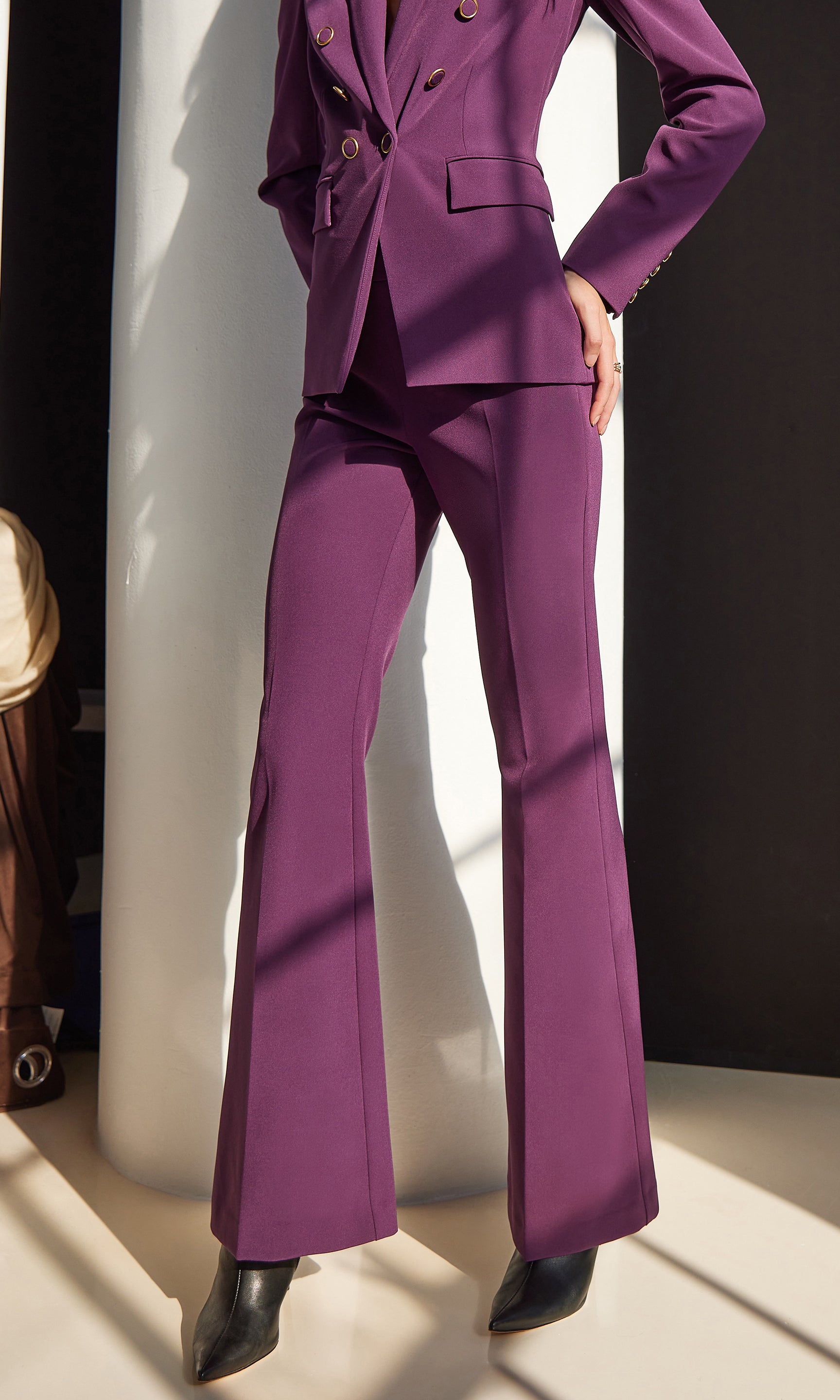 Purple suit with matching pants and shoes on a white background