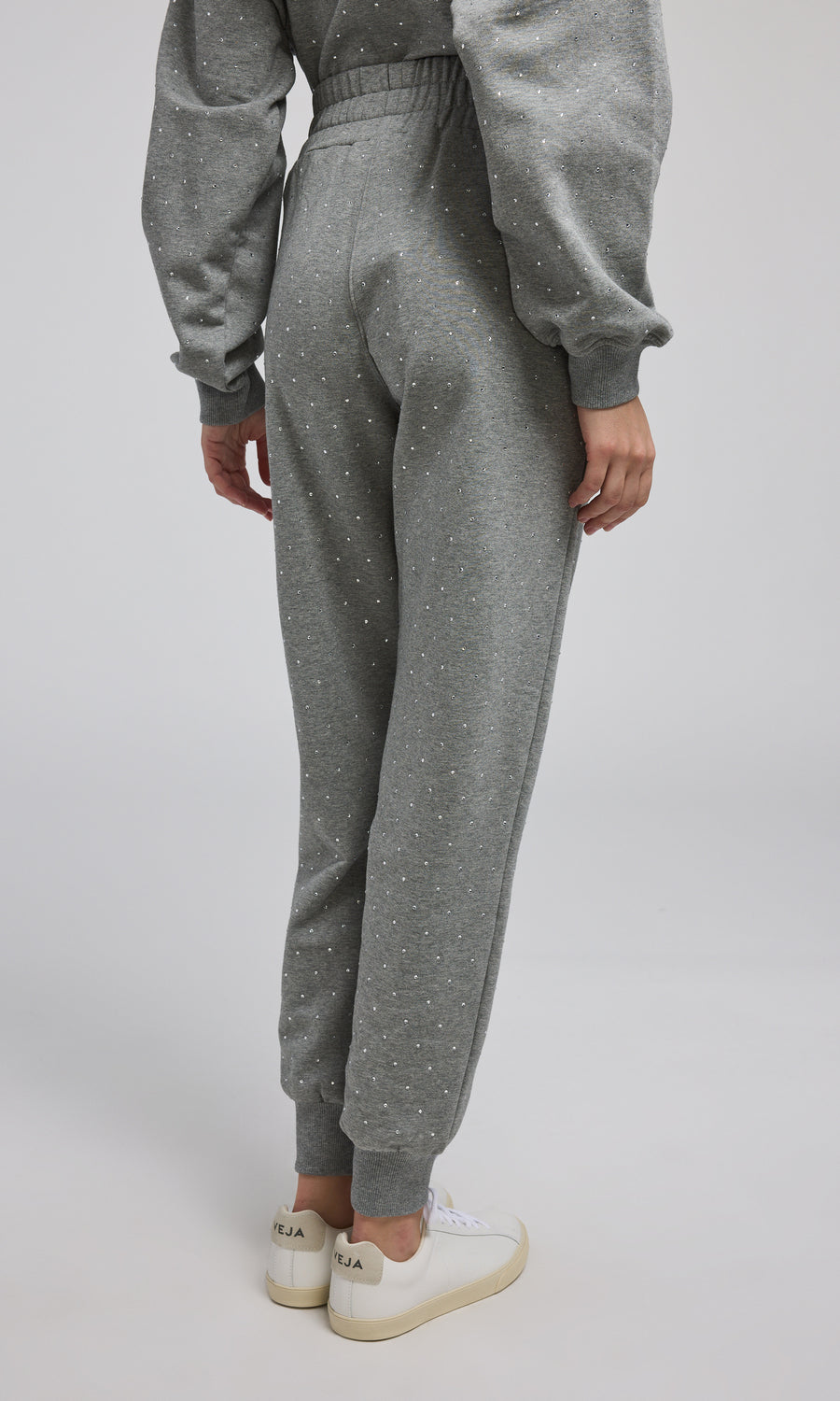 Comfortable grey crystal sweatpants made from a soft, stretchy material, ideal for casual and cozy looks.