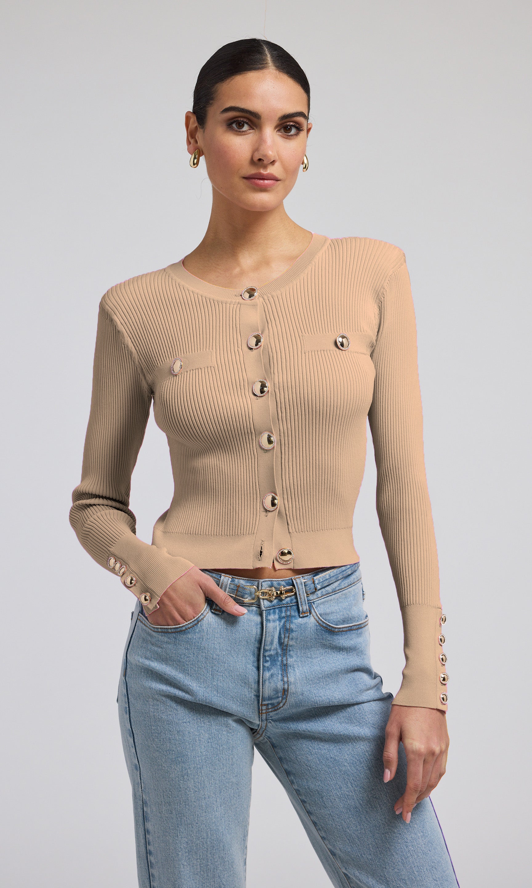 A stylish camel ribbed cardigan with gold buttons, perfect for adding a touch of elegance to any outfit.