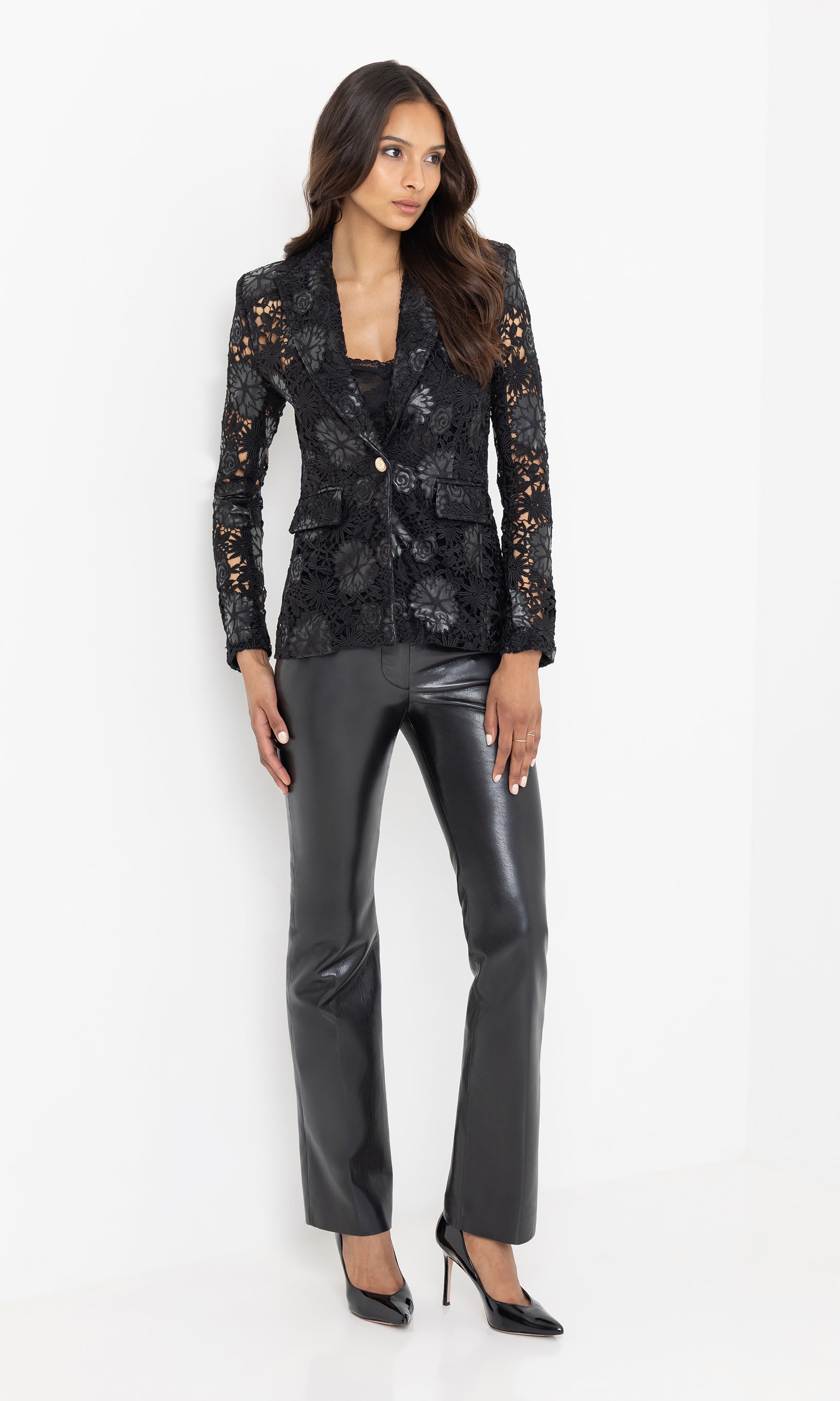 The model stands in a full-body view, styled in the Aimee Blazer with vegan leather pants for a sleek, modern look.