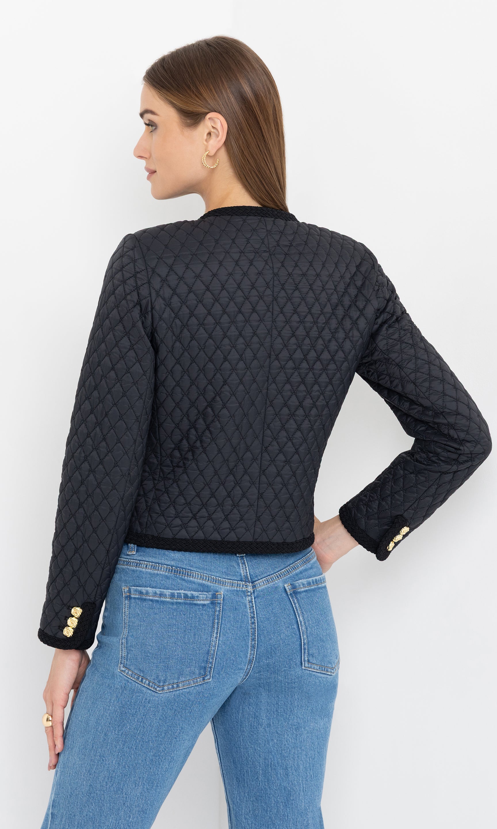 Rear view highlighting the jacket’s structured fit and quilted detailing.
