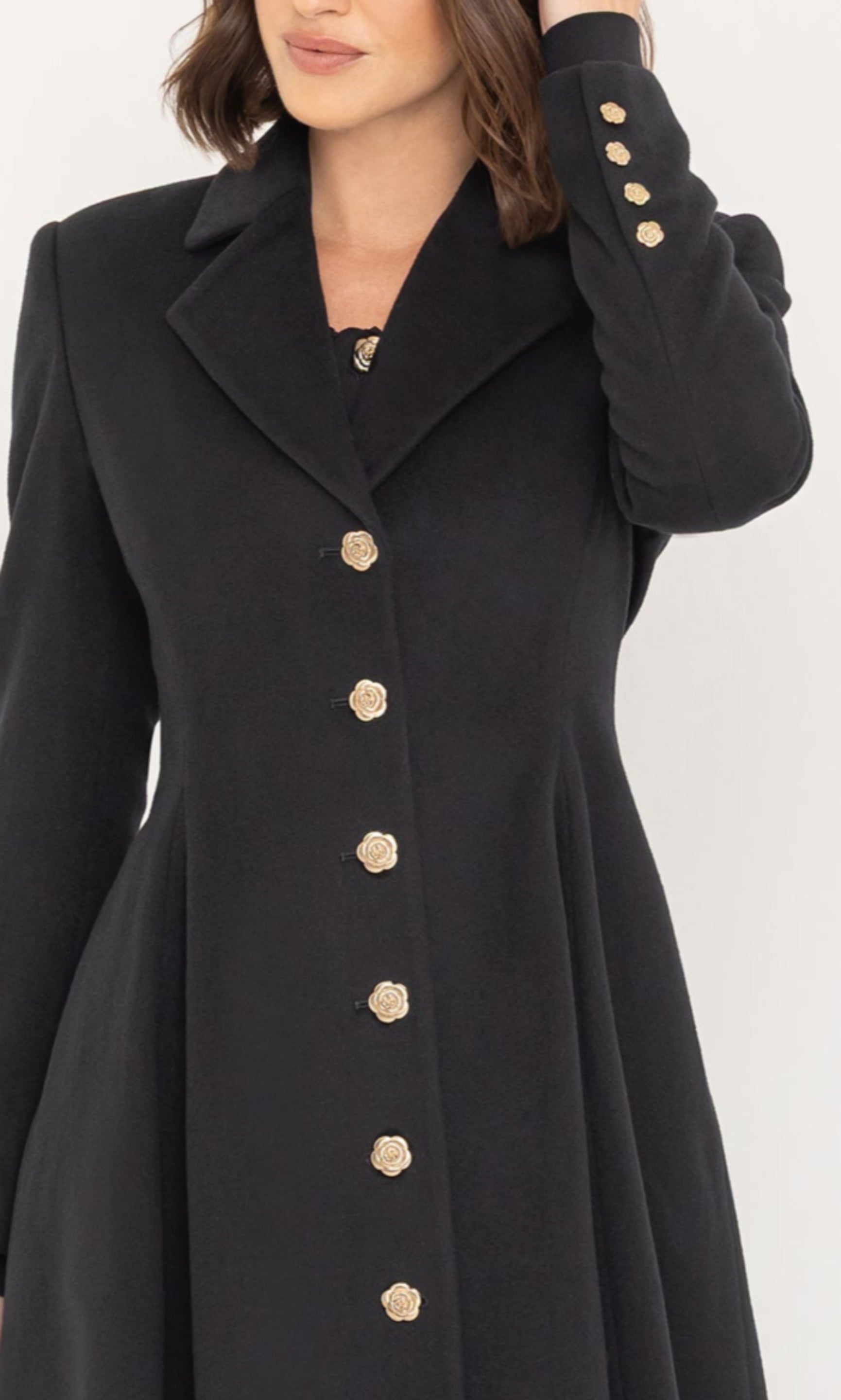 Close-up partial view of the Judy Wool Coat highlighting the gold button detailing and tailored lapels.