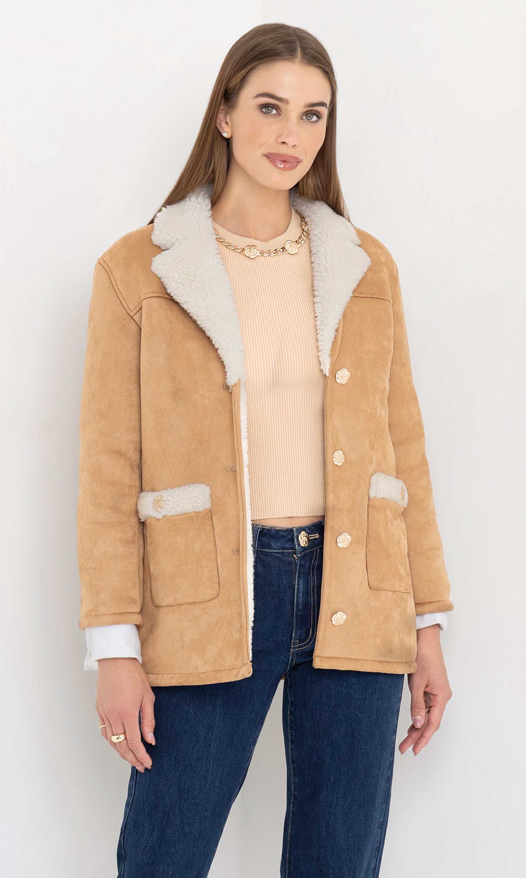 Front view of the model wearing the luvia faux shearling jacket with ivory lining.