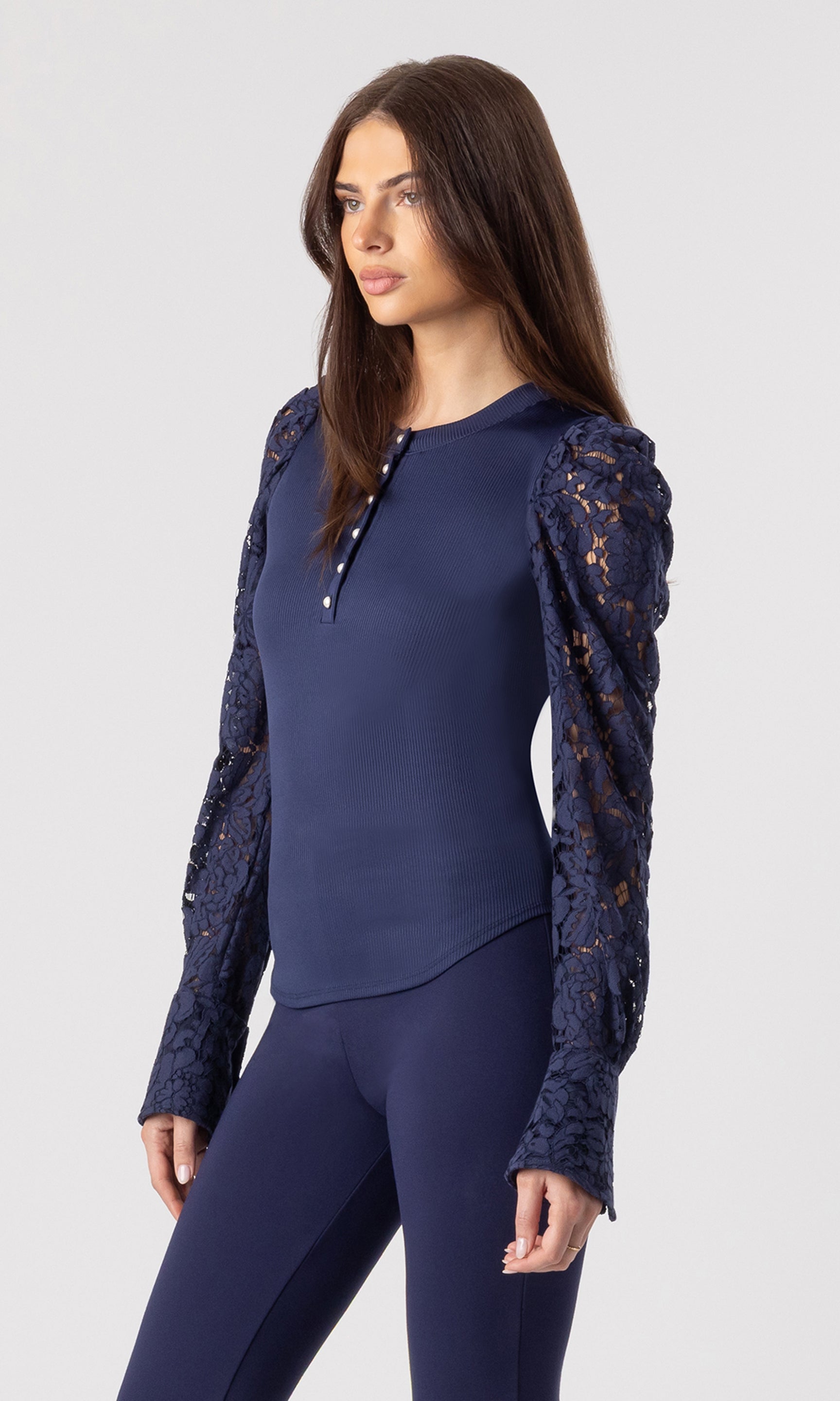 side view image of model wearing the Macoy top in navy with matching navy leggings