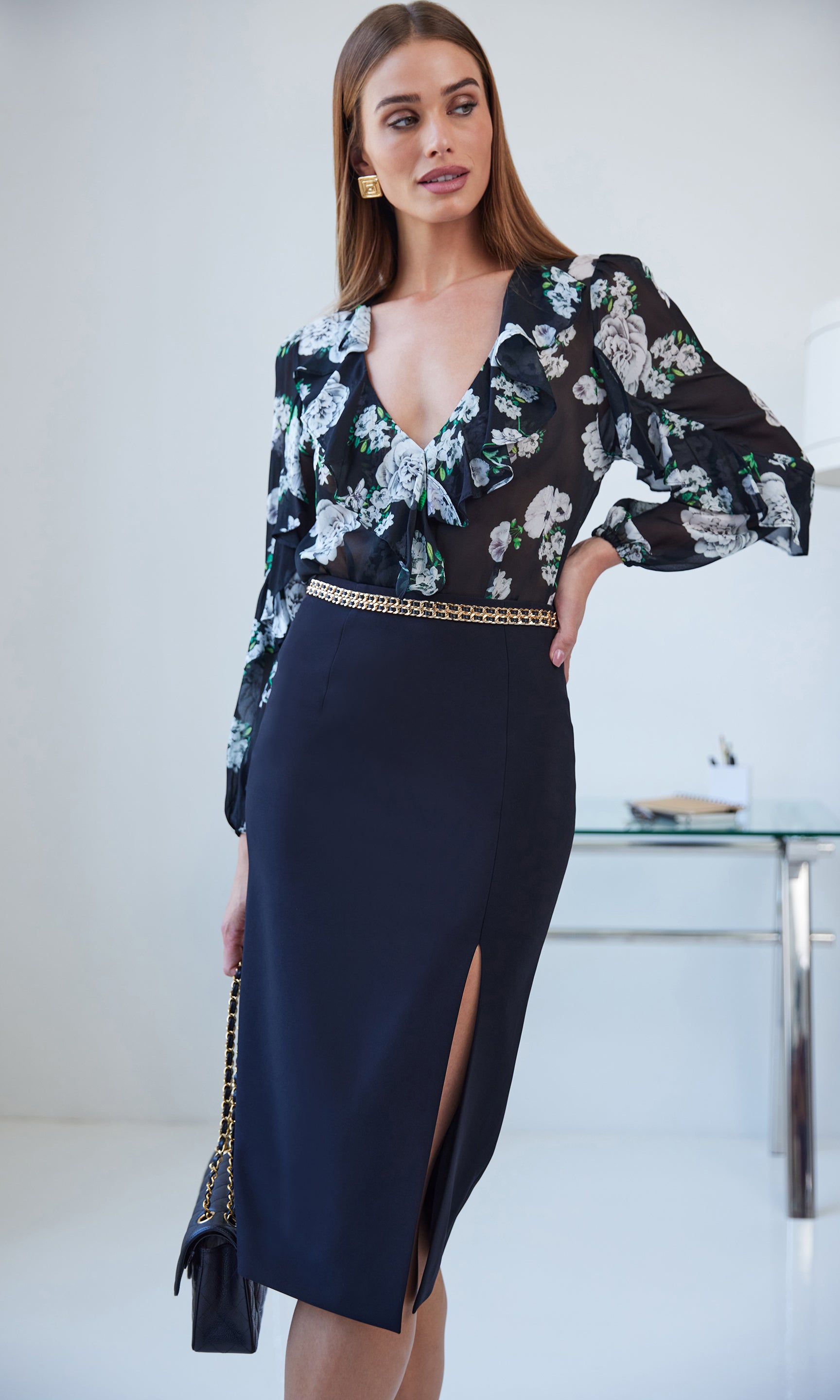 Three-quarter front view of the margery crepe skirt showing the tailored fit.