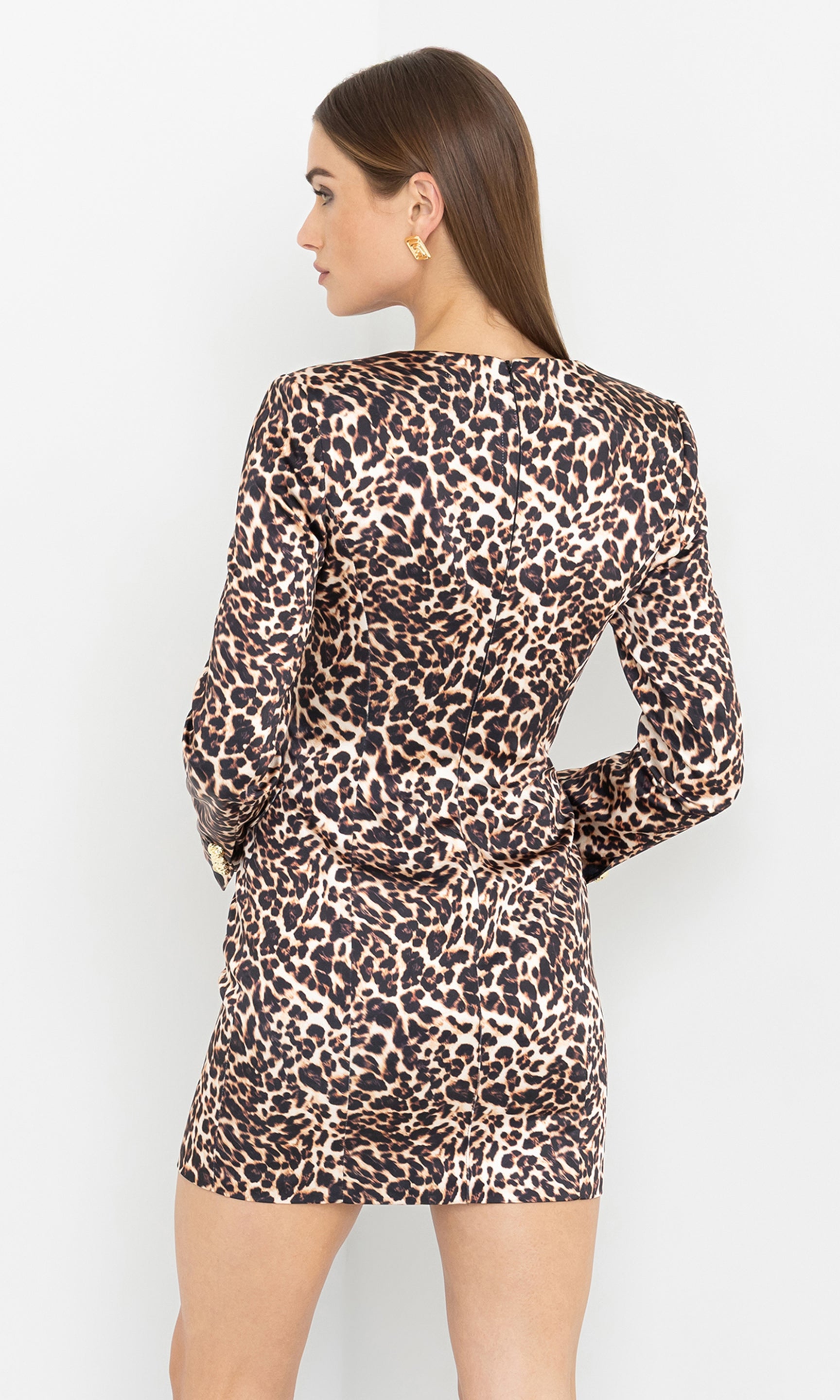 Rare view of the model in the Odelia Leo Satin Dress, emphasizing its tailored shape and animal print design.
