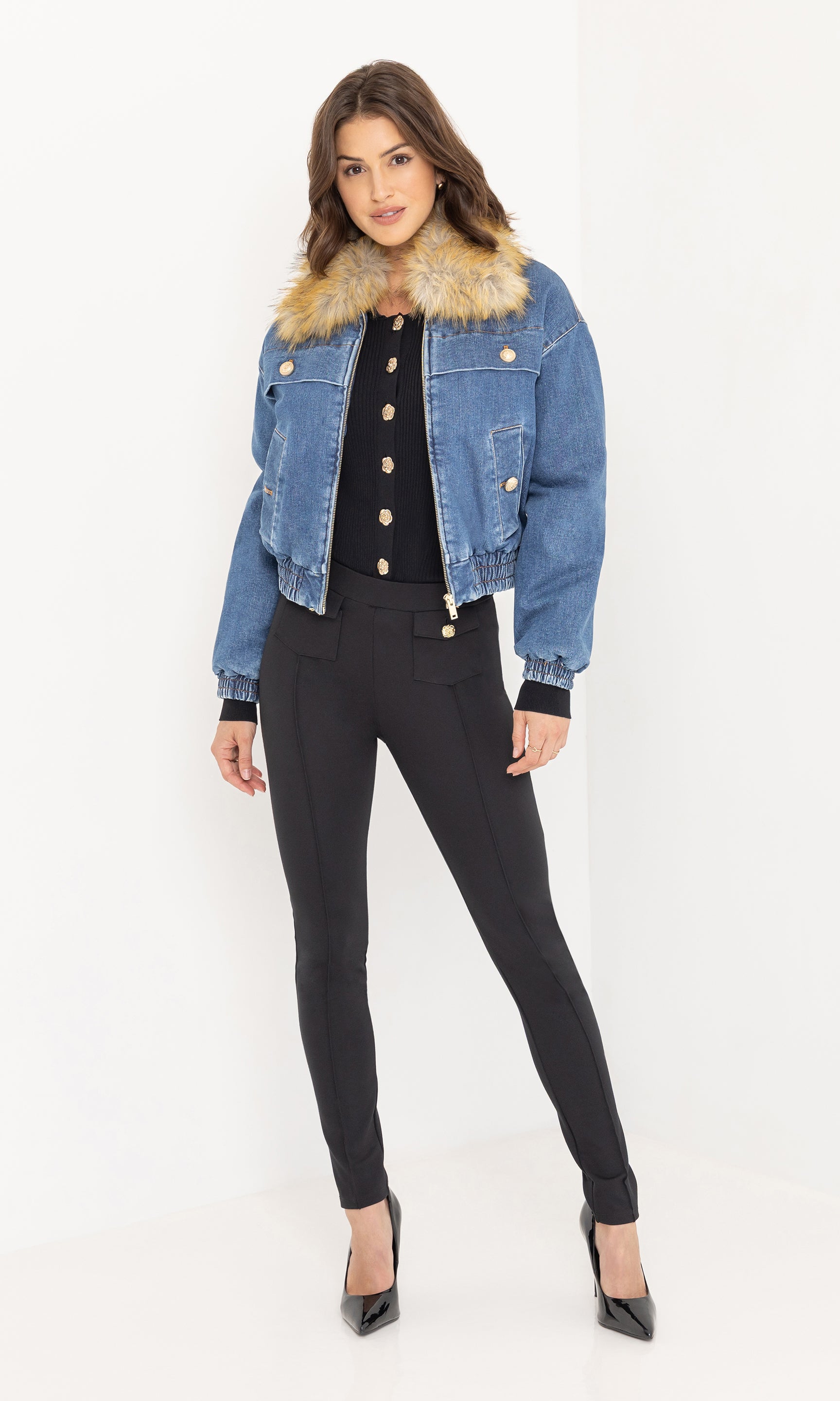 Full body view of the Paco Denim Bomber styled with black trousers and heeled sandals.