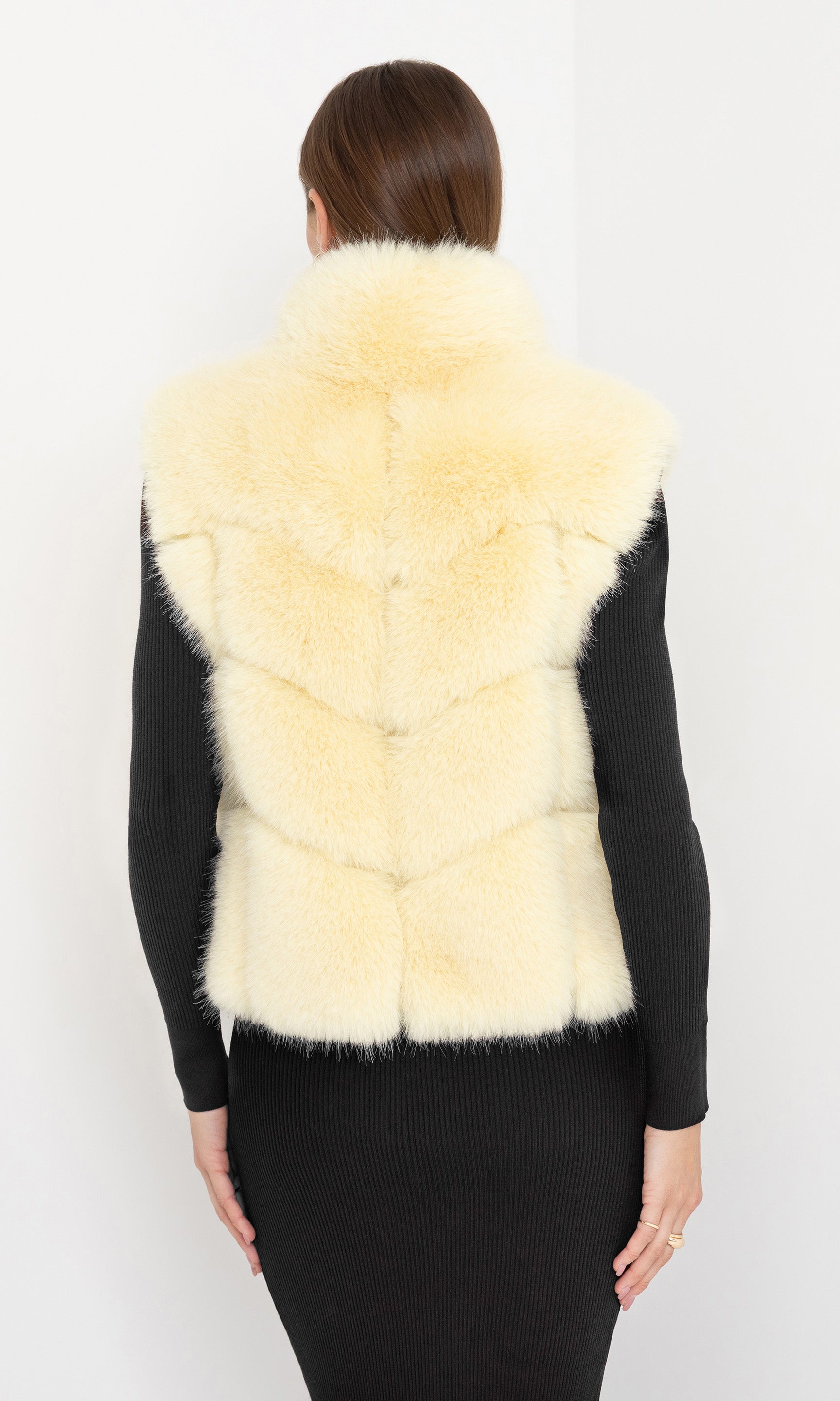 Rear view of Rosario Faux Fur Vest in cream, displaying the smooth faux fur finish.