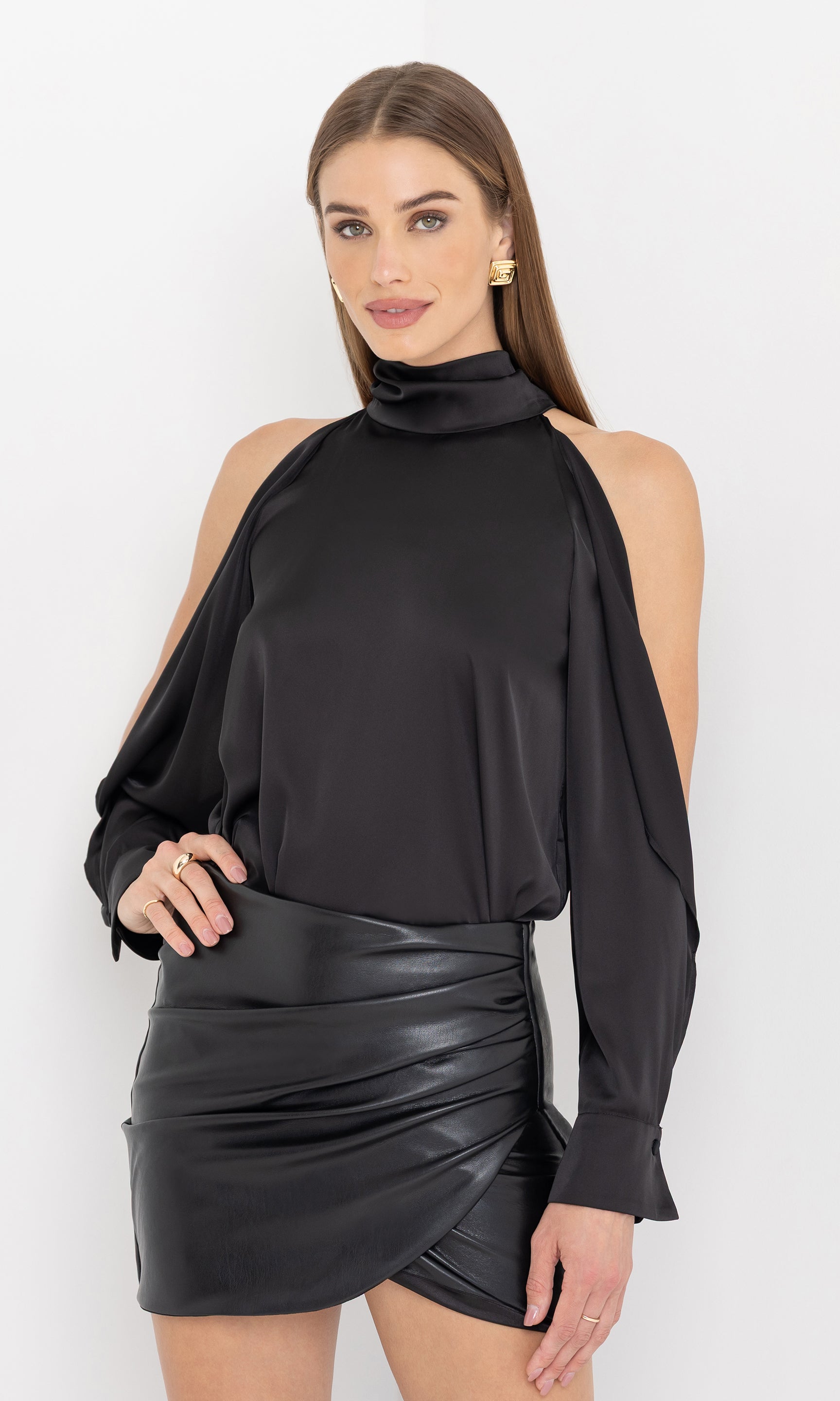 Side view of Rossi Halter Blouse in black, revealing the open shoulder cutouts and chic, flowy sleeves.