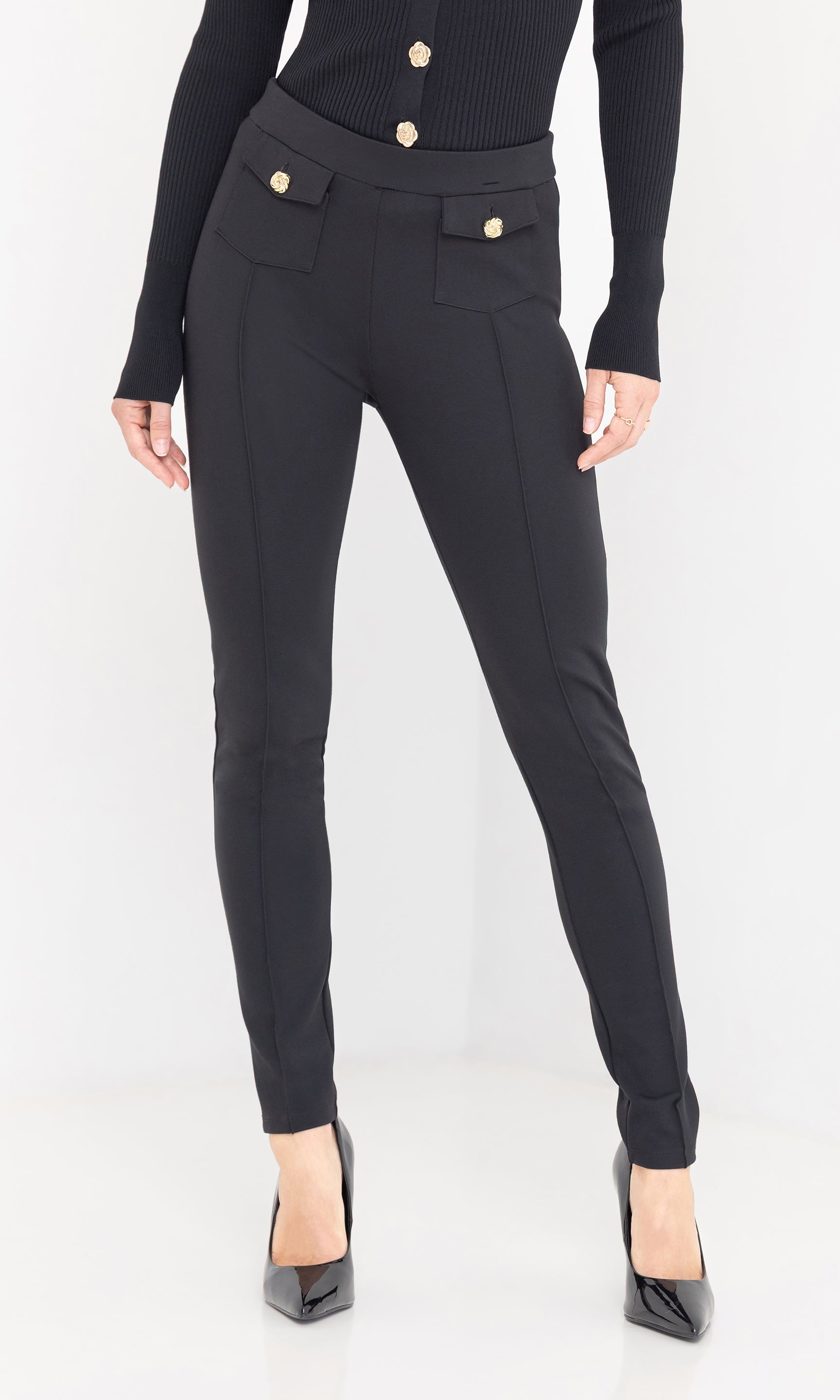 Roy Ponte Leggings in black showcased in a front view, paired with a matching black blazer and pointed-toe heels for a sleek, tailored look.