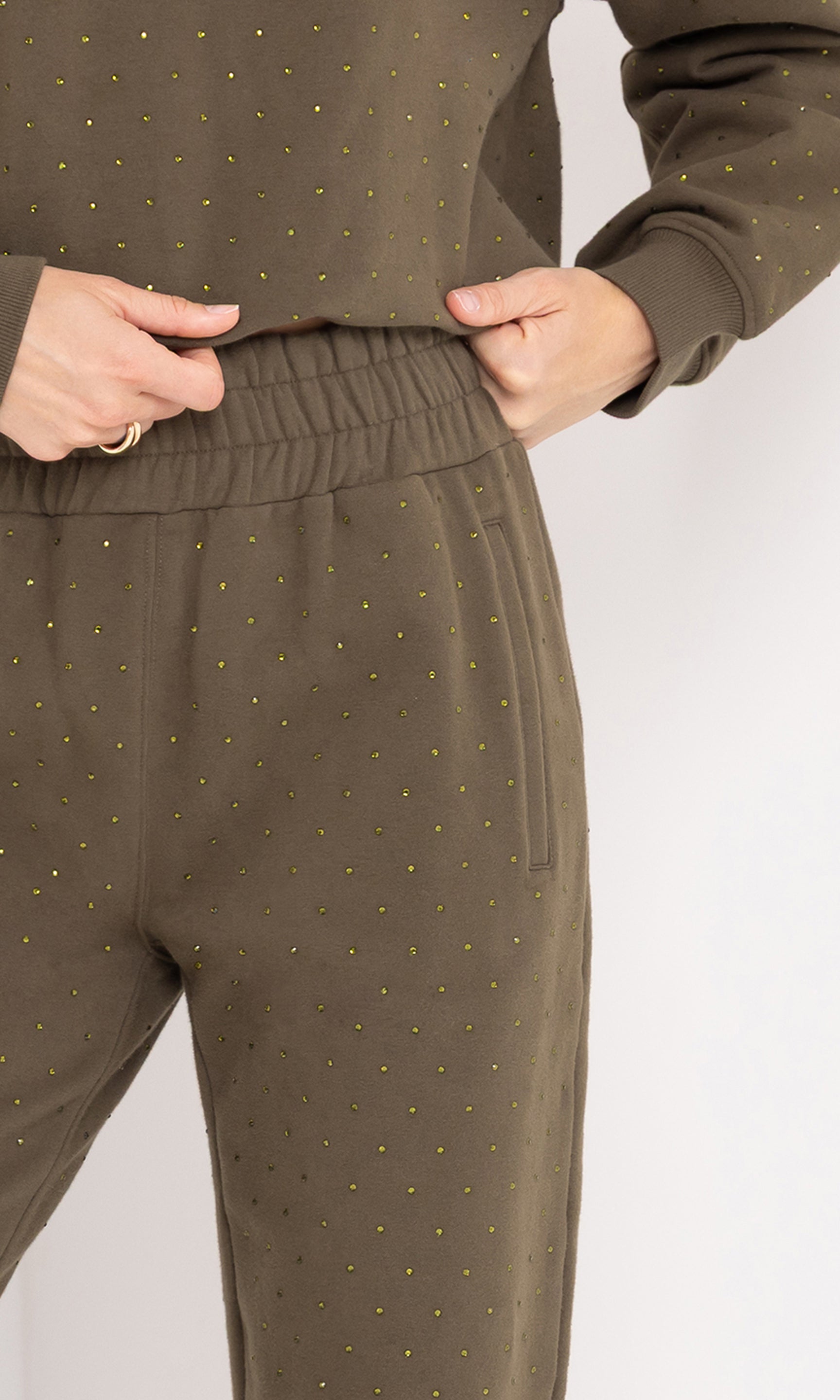 Close-up waist view of the Ruel Crystal Sweatpants, focusing on the waistband and crystal detailing.