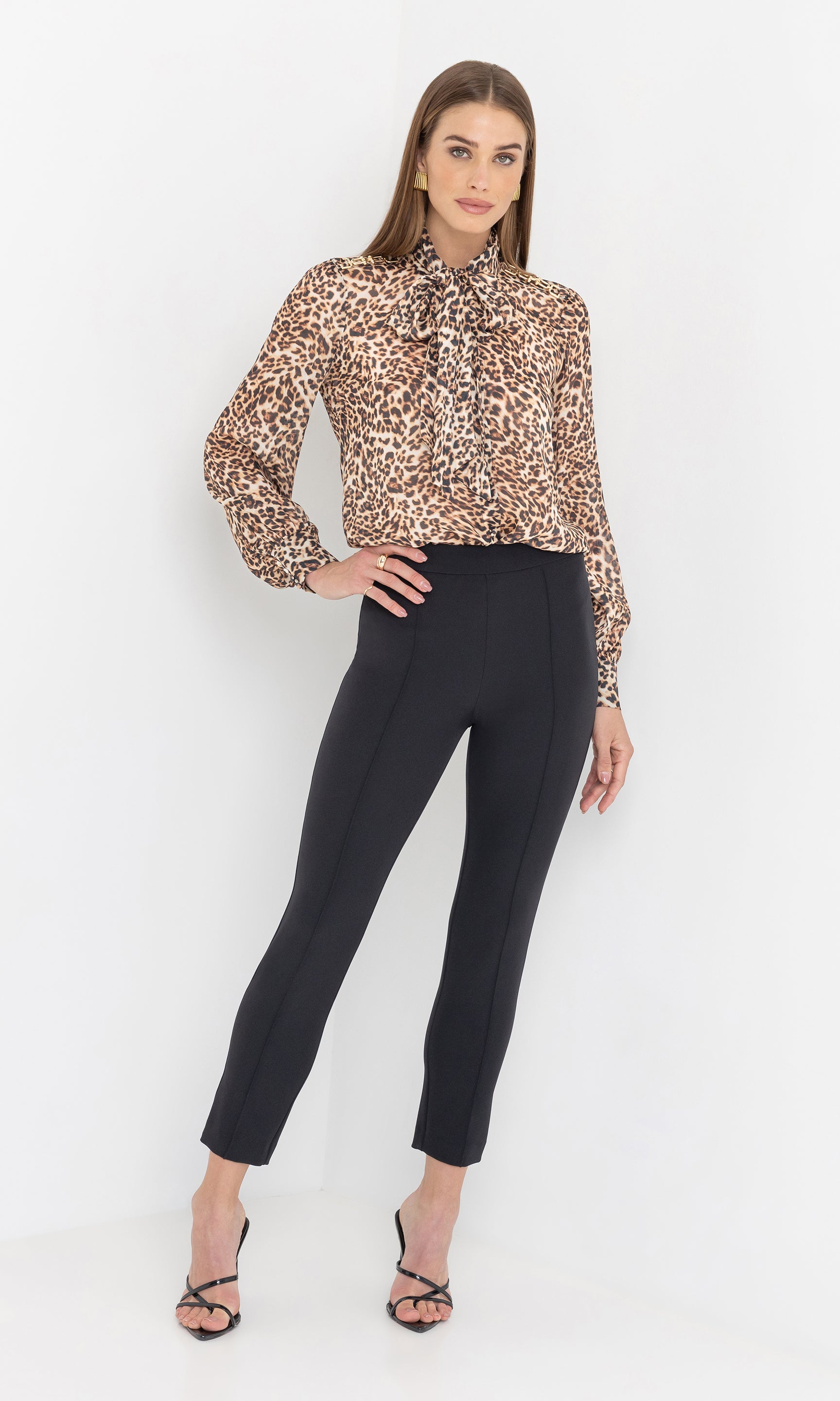 Full-body studio shot of the Lonny Crepe Pants styled with a patterned top.