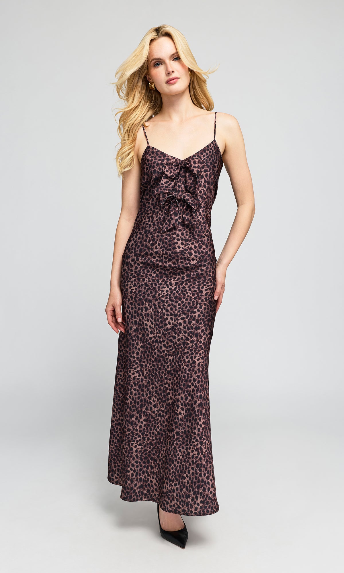 Model wearing a floor-length leopard-print slip dress with spaghetti straps and a ruffled sweetheart neckline.