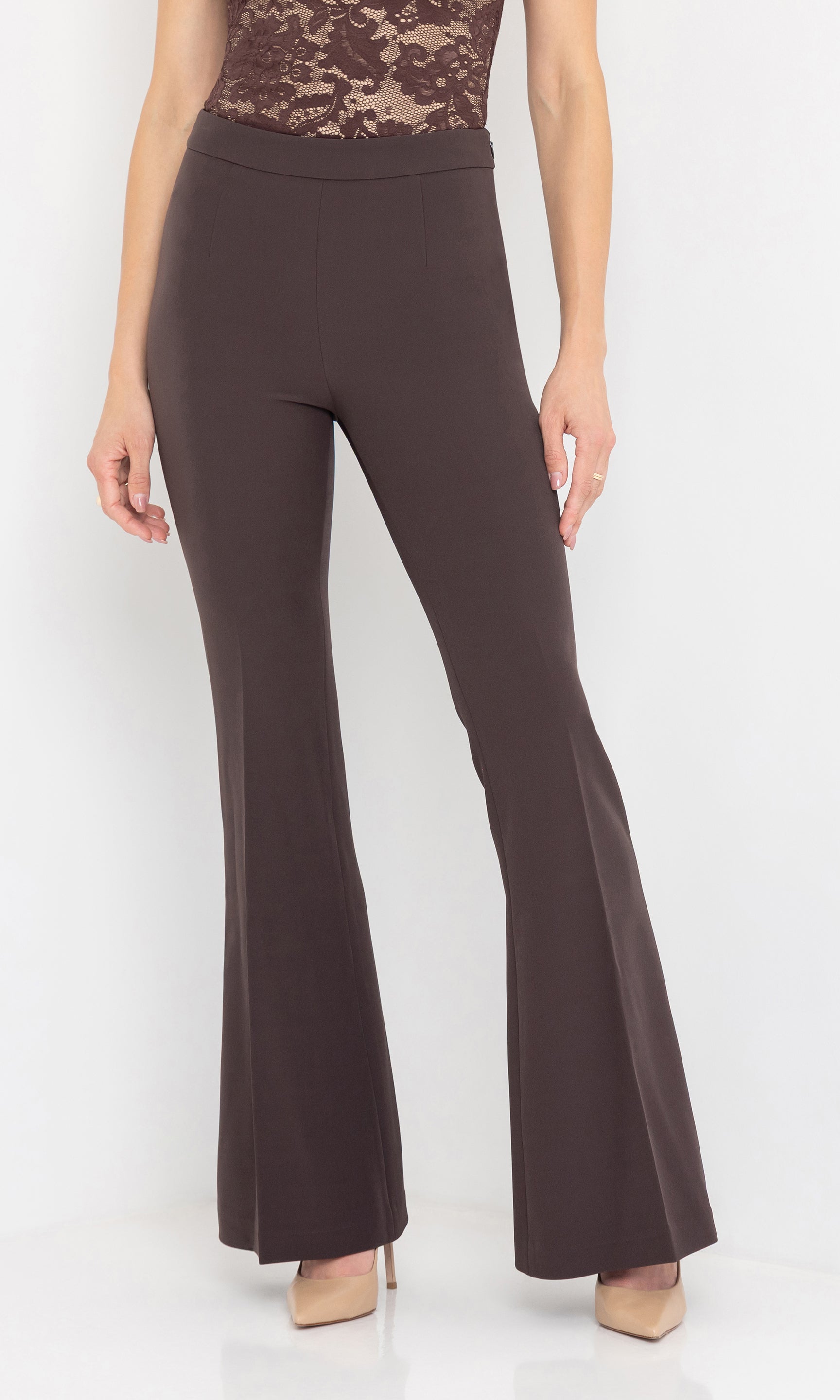 Front view of the model wearing the wesley crepe pants styled with a lace bodysuit.