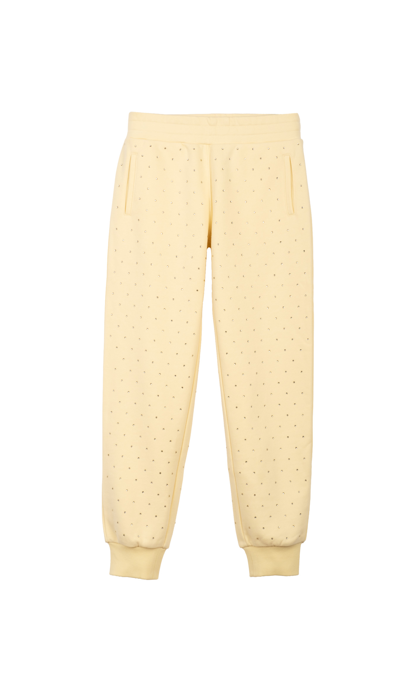 Light yellow sweatpants with crystal embellishments on a white background