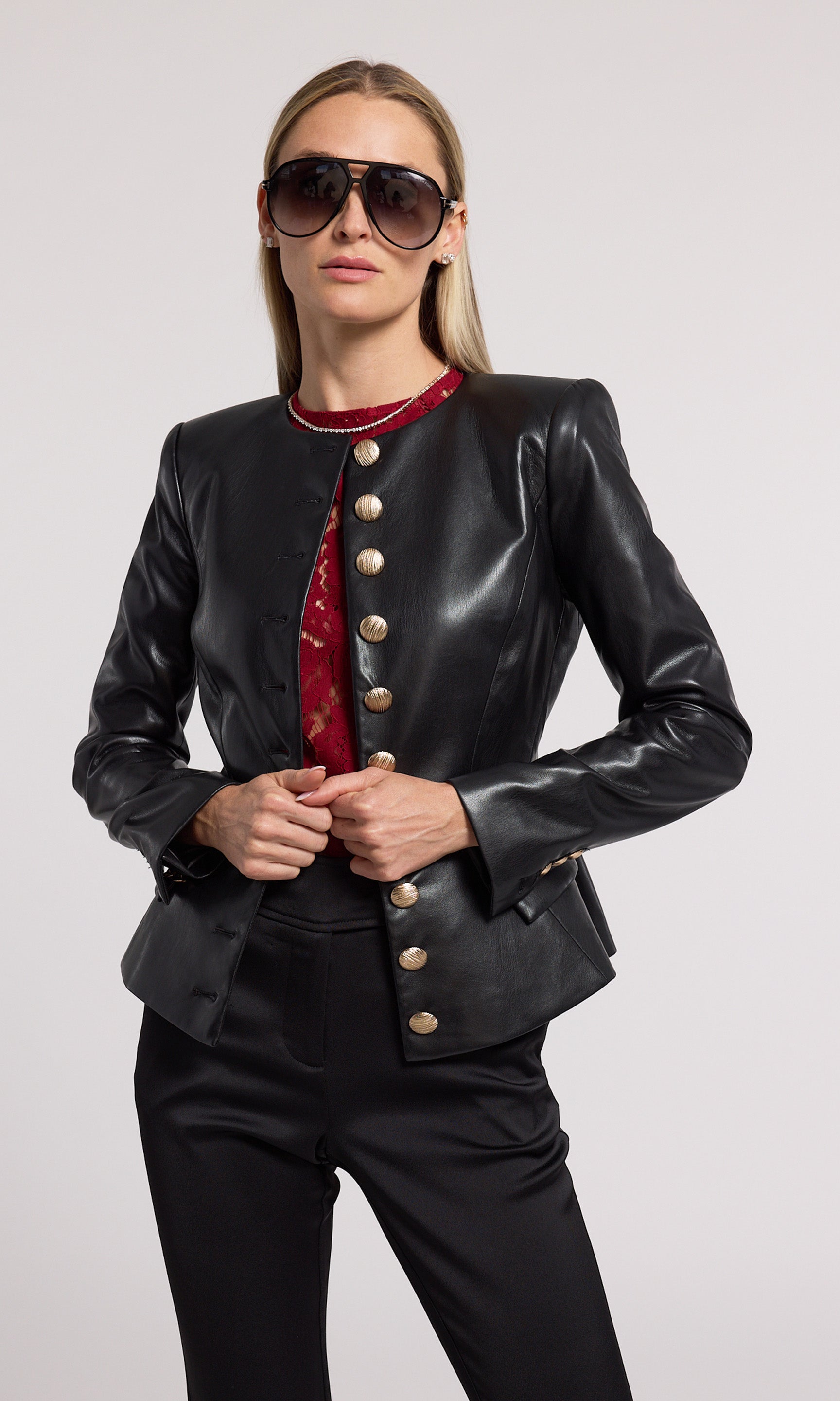 A stylish black vegan leather jacket made from soft, stretchy fabric, emphasizing comfort and contemporary fashion.