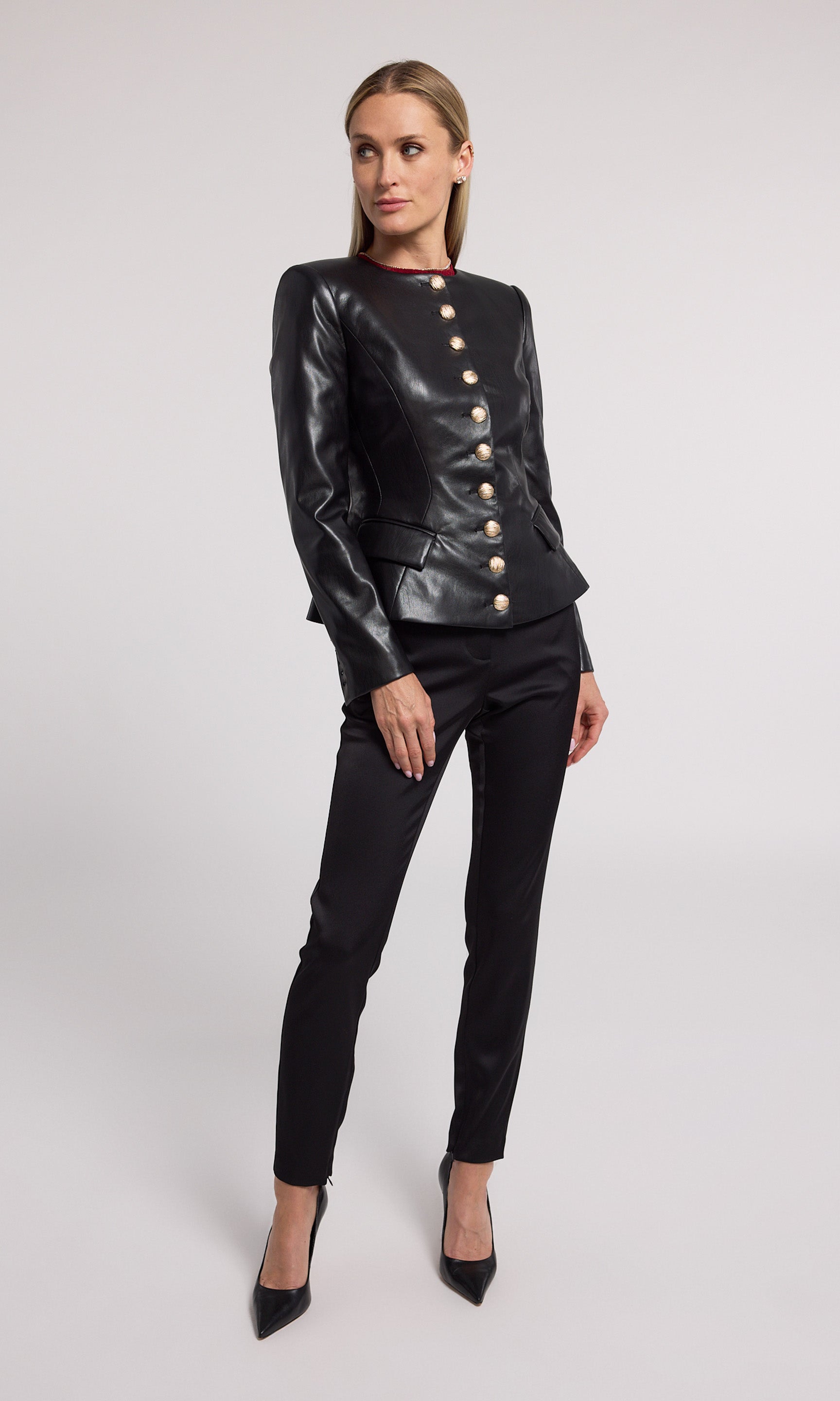 A stylish black vegan leather jacket made from soft, stretchy fabric, emphasizing comfort and contemporary fashion.