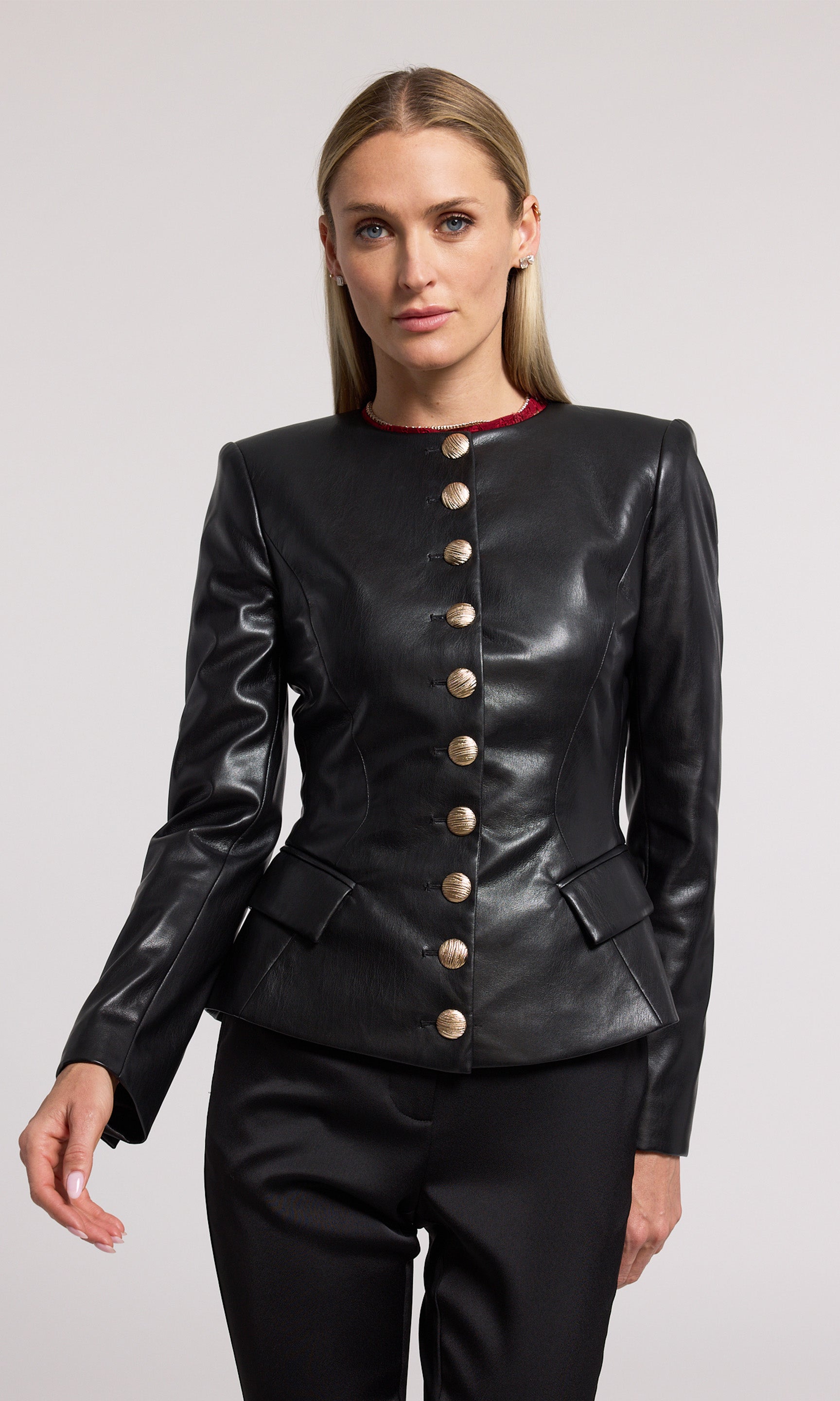 A stylish black vegan leather jacket made from soft, stretchy fabric, emphasizing comfort and contemporary fashion.