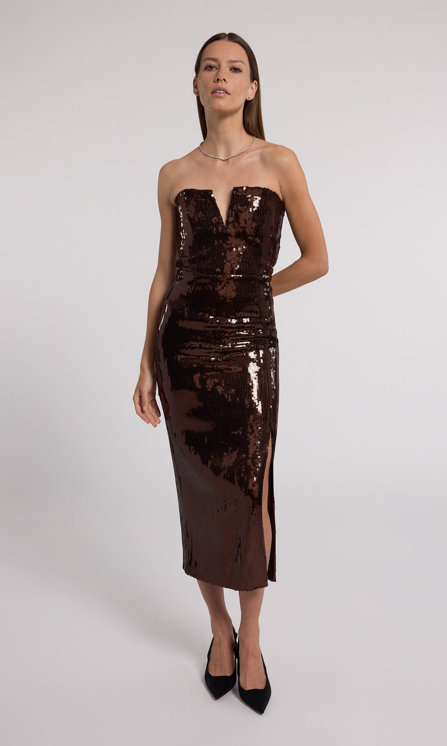 A stunning strapless dress adorned with shimmering brown sequins, perfect for a glamorous evening event.