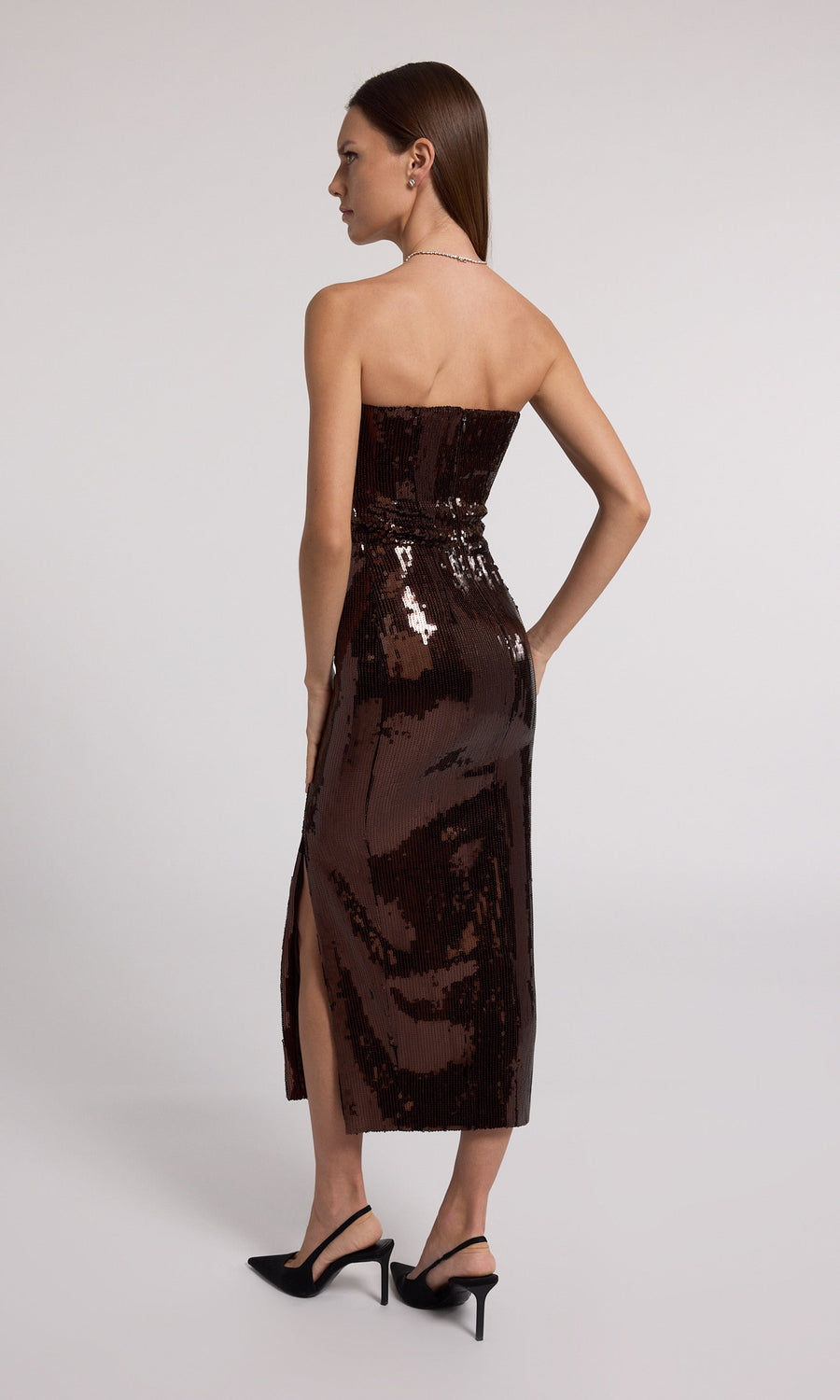 A stunning strapless dress adorned with shimmering brown sequins, perfect for a glamorous evening event.