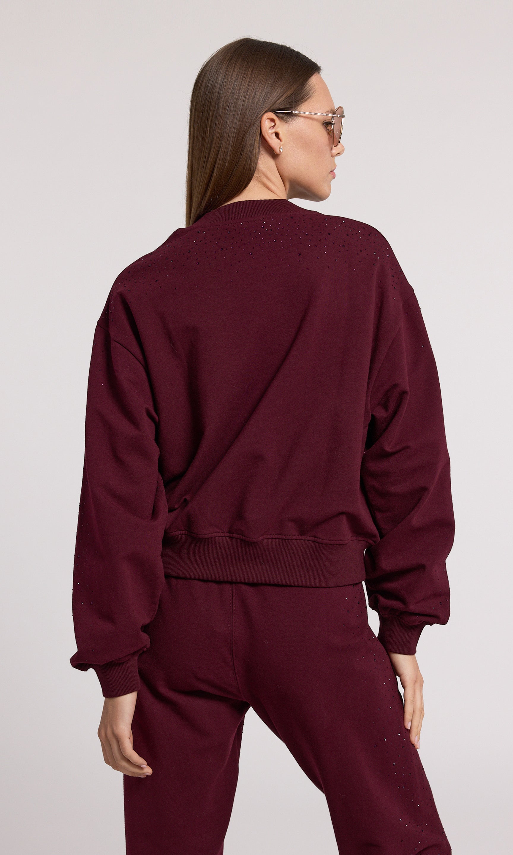 A black cherry sweatshirt crafted from soft with crystal and a stretchy fabric, showcasing comfort and style in a rich color.