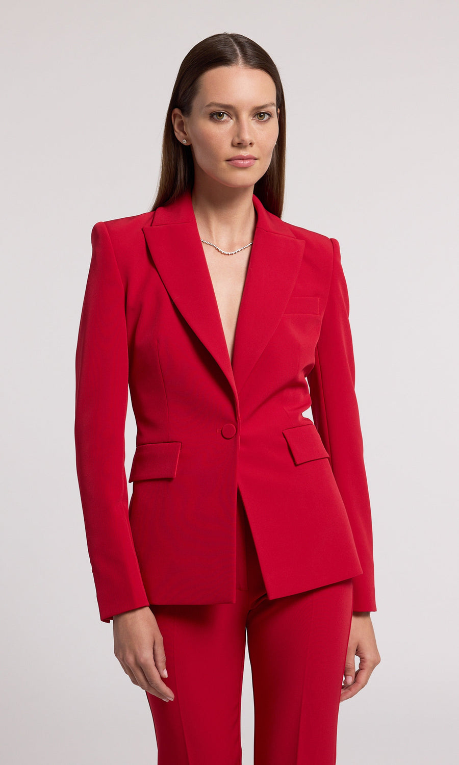 This red blazer is an ideal selection for any occasion, offering a classic look that complements various styles effortlessly.