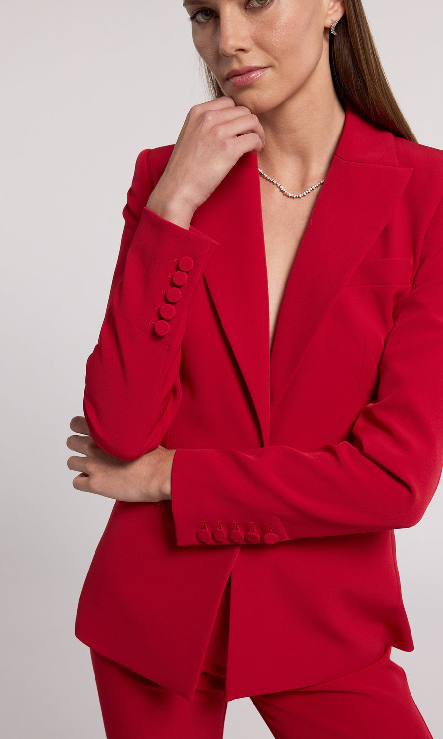 This red blazer is an ideal selection for any occasion, offering a classic look that complements various styles effortlessly.