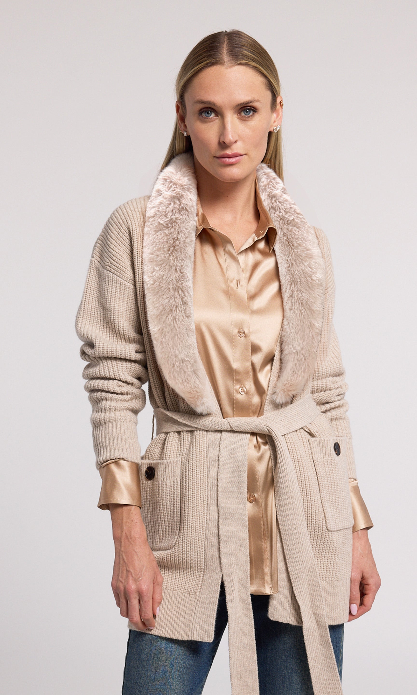 A chic wool cardigan with a plush faux fur collar, offering a blend of comfort and style for any occasion.