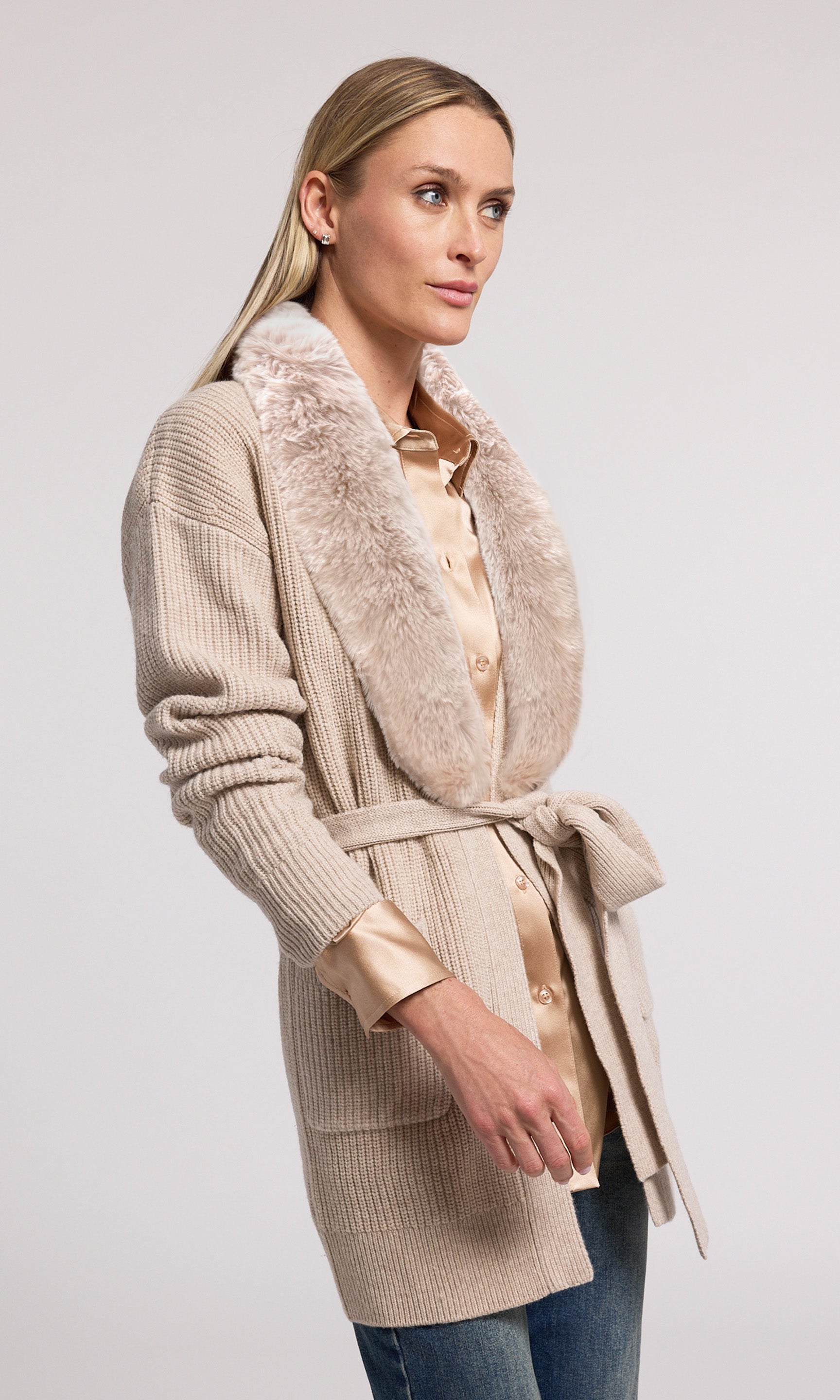 A chic wool cardigan with a plush faux fur collar, offering a blend of comfort and style for any occasion.