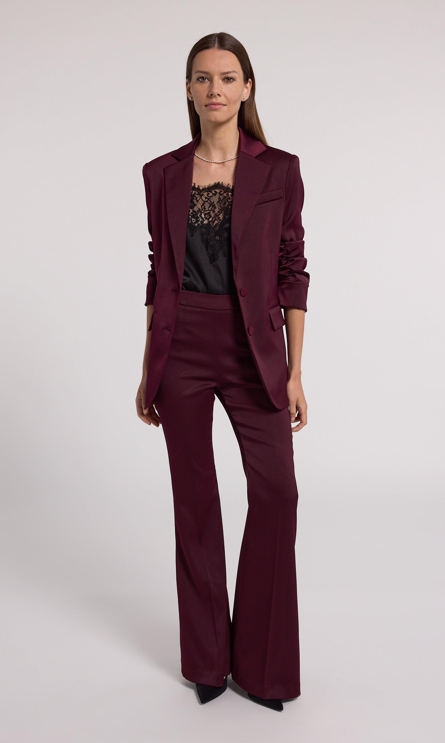 Burgundy satin pants crafted from stretchy fabric, offering comfort and a stylish fit for various occasions.