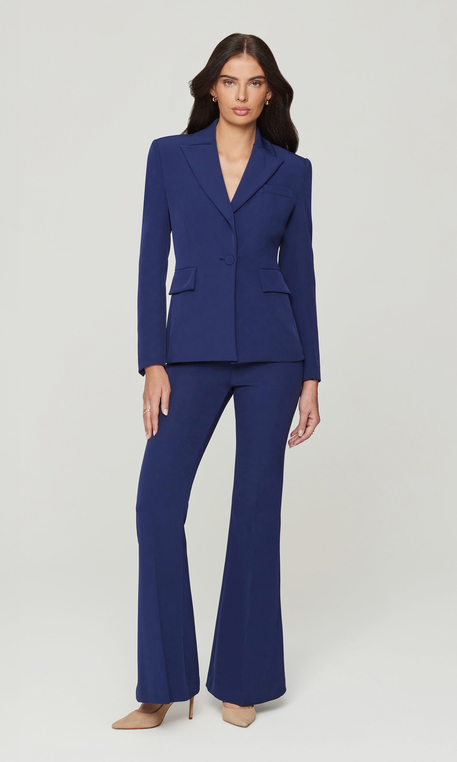 Woman wearing a blue suit on a white background