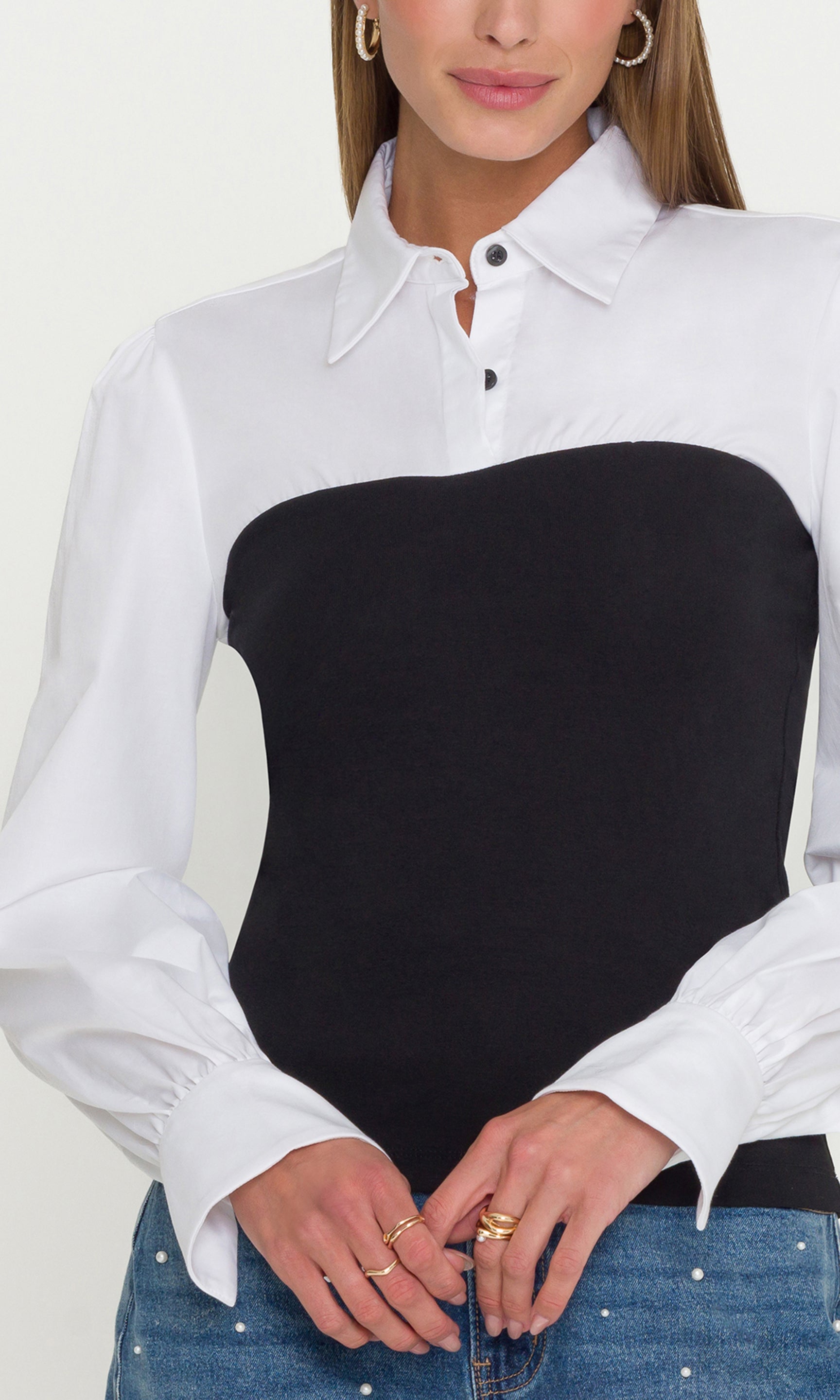White shirt with black bodice worn by a person on a white background