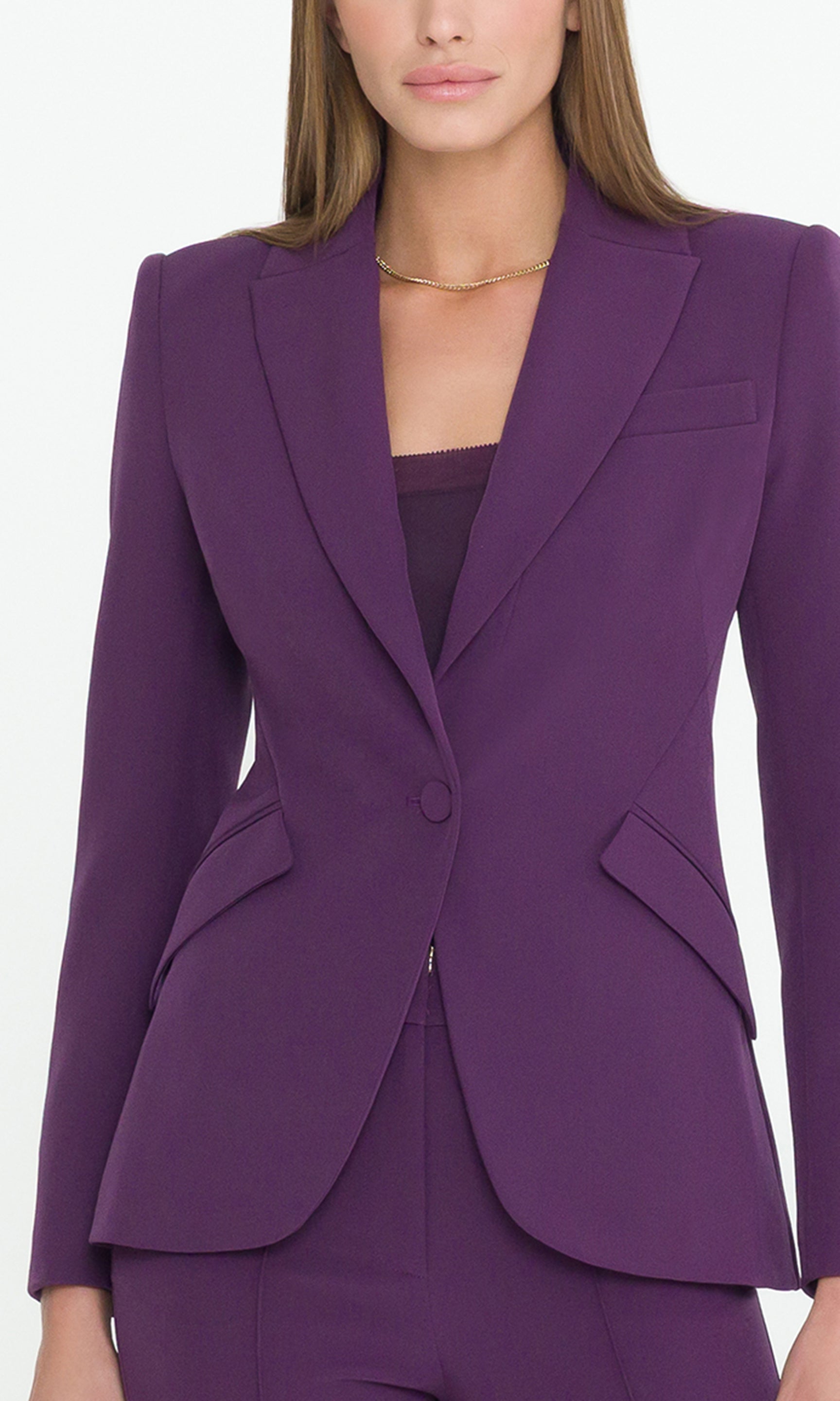 Detal image of purple blazer on a model showcasing the tailored fit