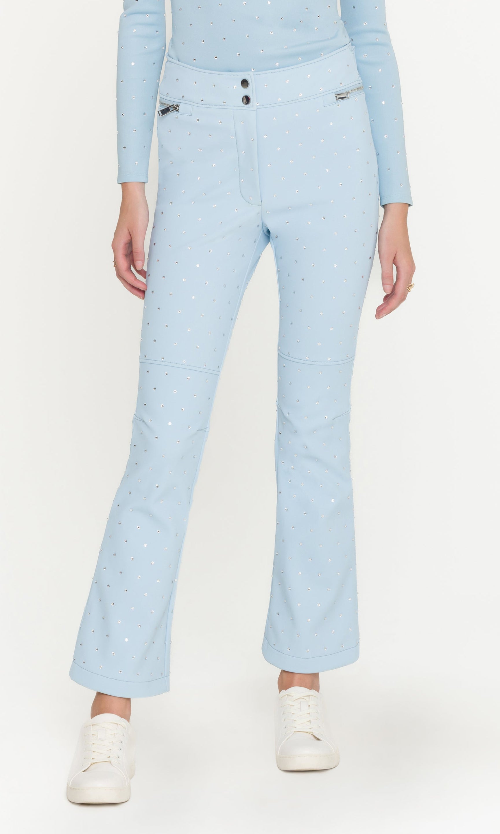 Light blue pants worn by a person on a white background