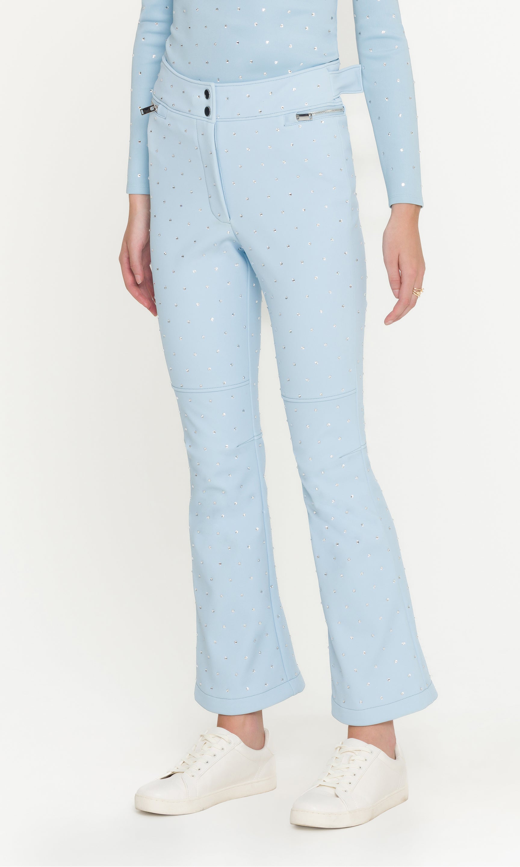 Light blue jeans worn by a person on a white background