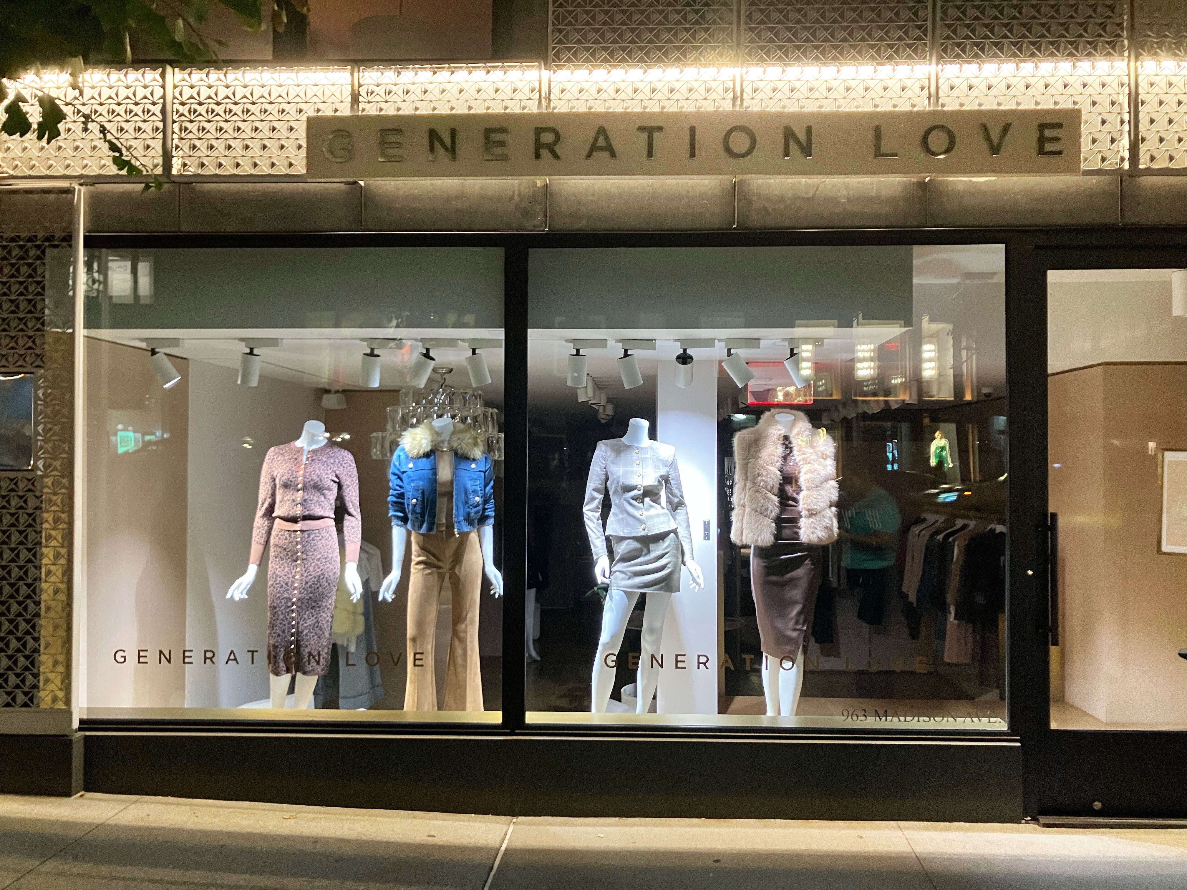 Storefront with 'Generation Love' branding and mannequins displaying fall style clothing.