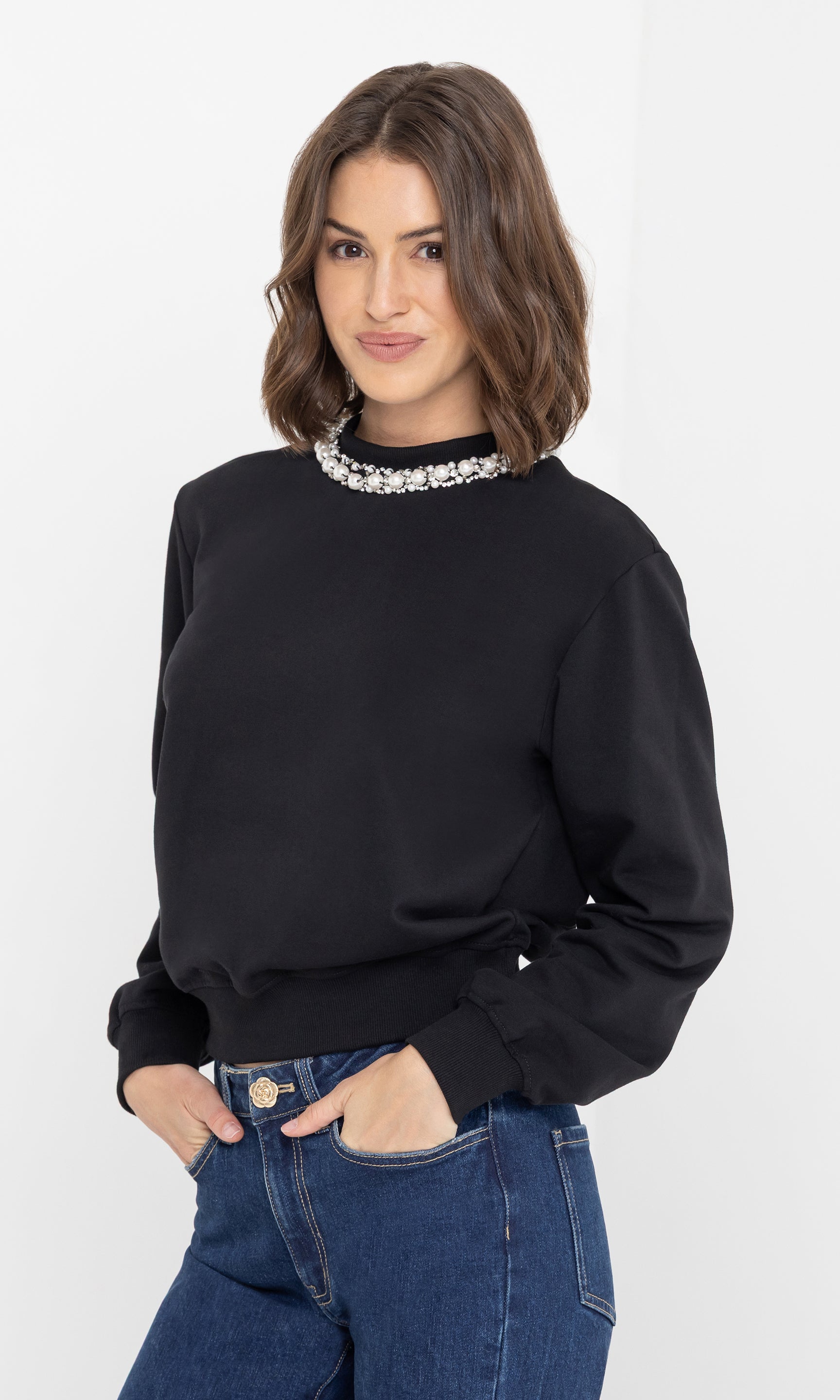 Side view of the jill pearl/crystal embellished sweatshirt emphasizing the pearl neckline.