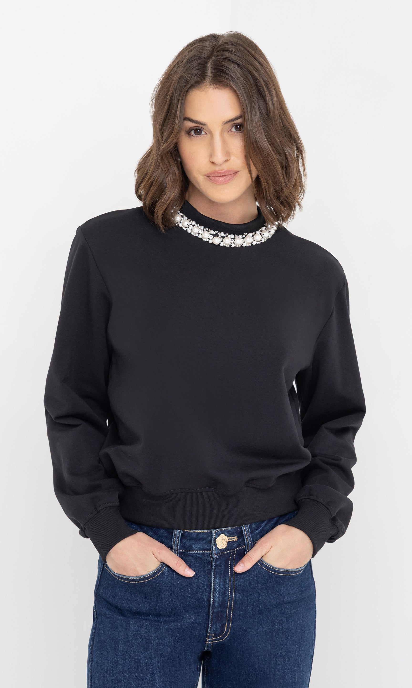 Front view of the model wearing the jill pearl/crystal embellished sweatshirt with relaxed fit.