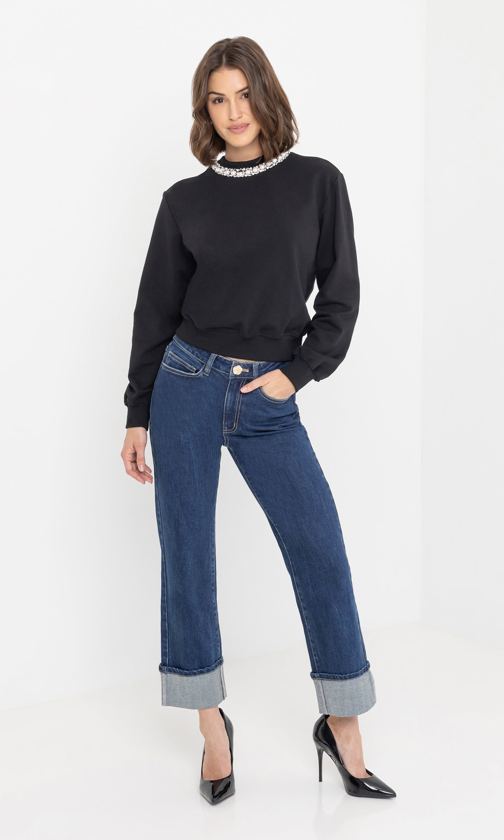 Full body front view of the jill pearl/crystal embellished sweatshirt styled with jeans.