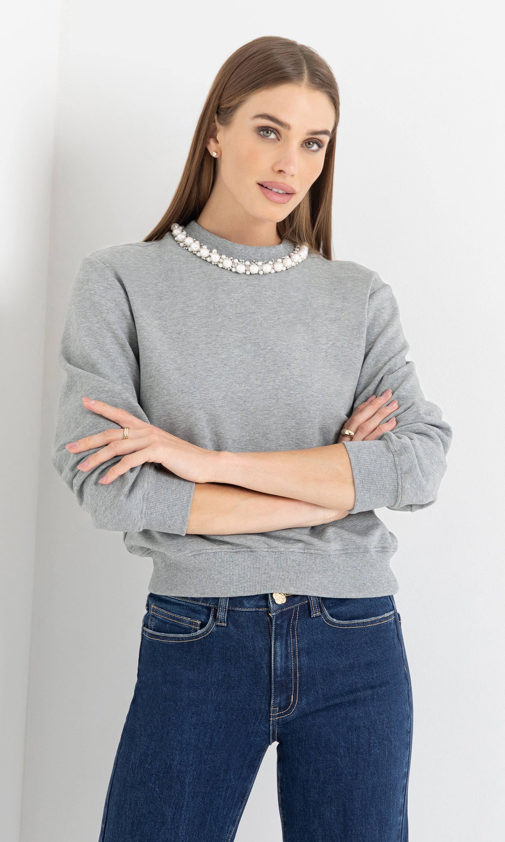 Front view of the model wearing the jill pearl/crystal embellished sweatshirt with relaxed fit.