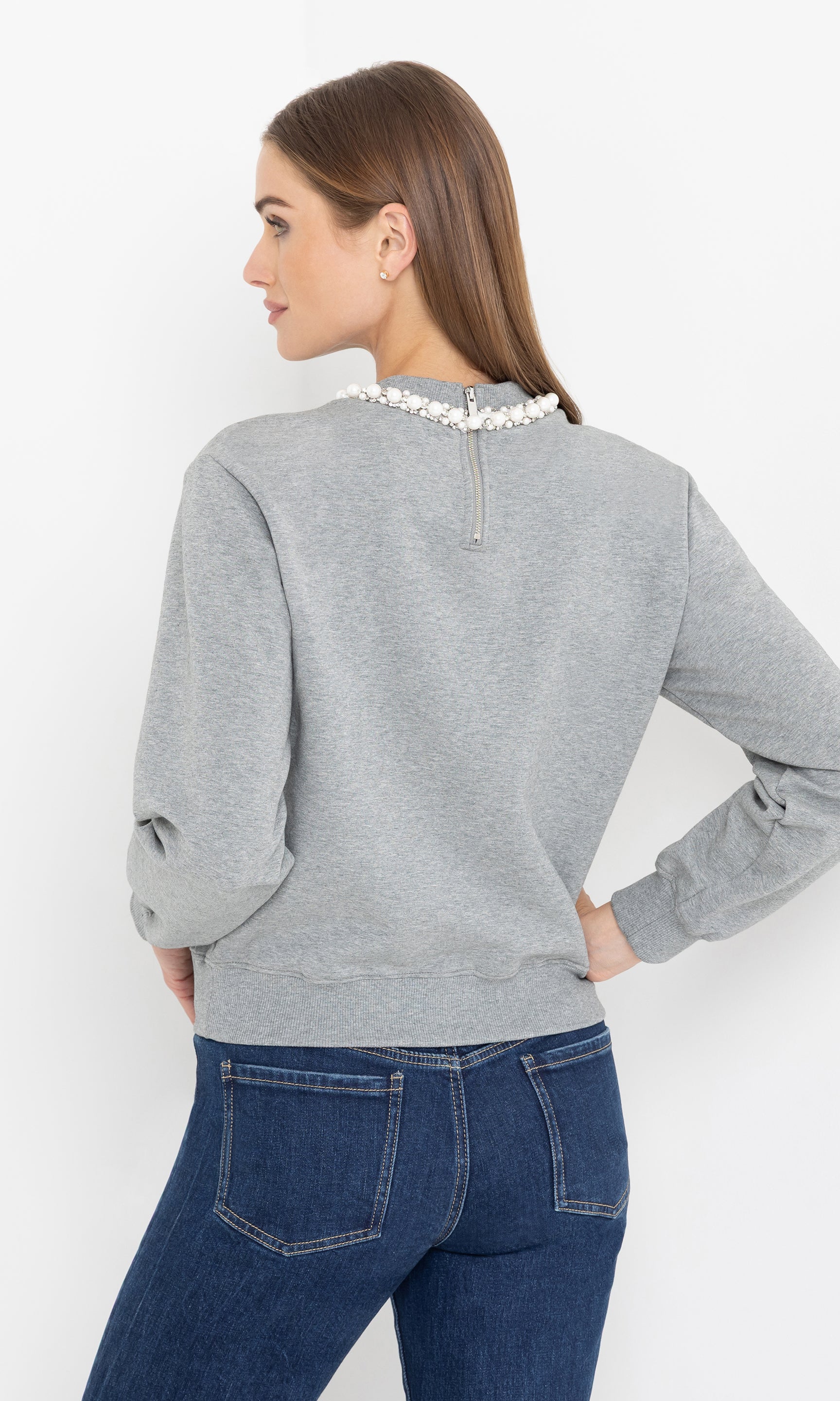 Side view of the jill pearl/crystal embellished sweatshirt showing the relaxed silhouette.