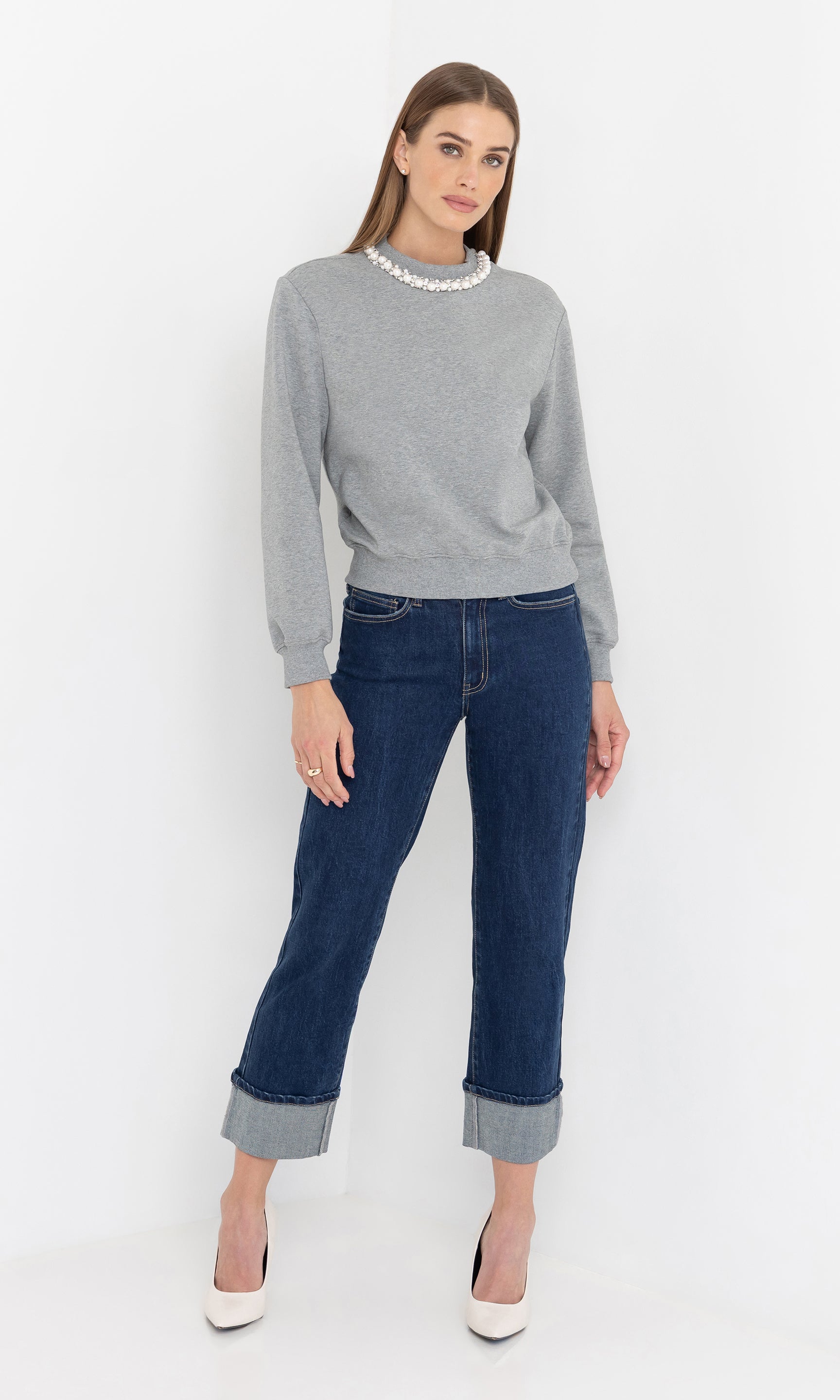 Full body front view of the jill pearl/crystal embellished sweatshirt styled with jeans.