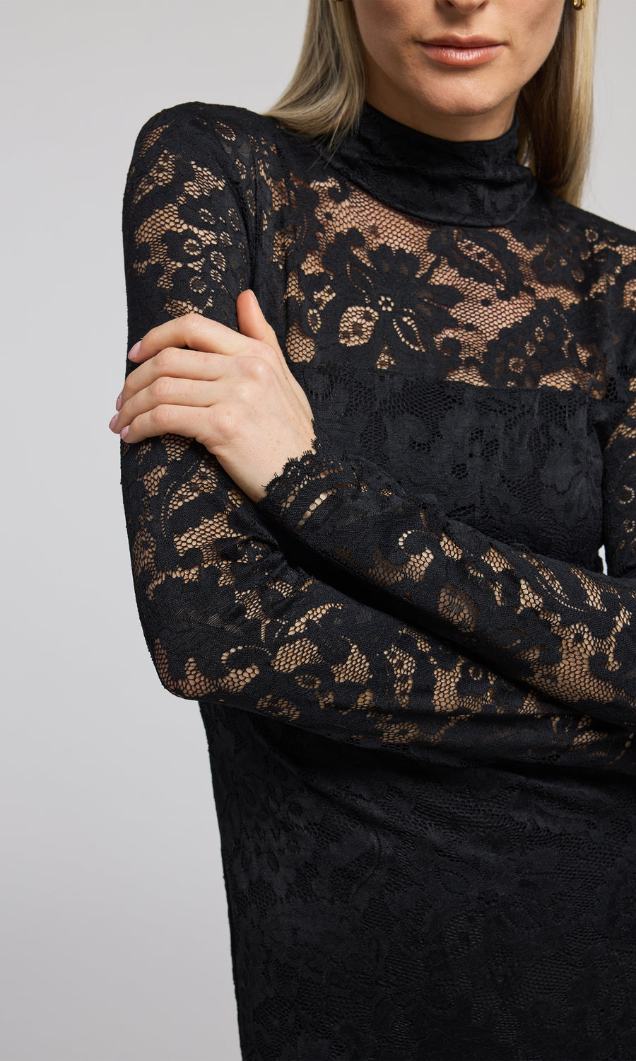 Elegant black lace dress with long sleeves, a high neck, and a striking high slit, perfect for formal occasions.