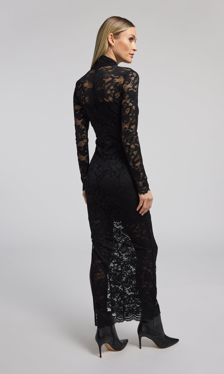 Elegant black lace dress with long sleeves, a high neck, and a striking high slit, perfect for formal occasions.