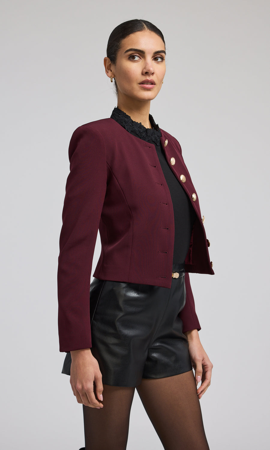 A striking malbec jacket with front buttons, highlighting a chic and fashionable outerwear choice.