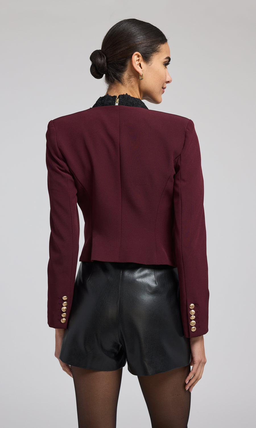 A striking malbec jacket with front buttons, highlighting a chic and fashionable outerwear choice.