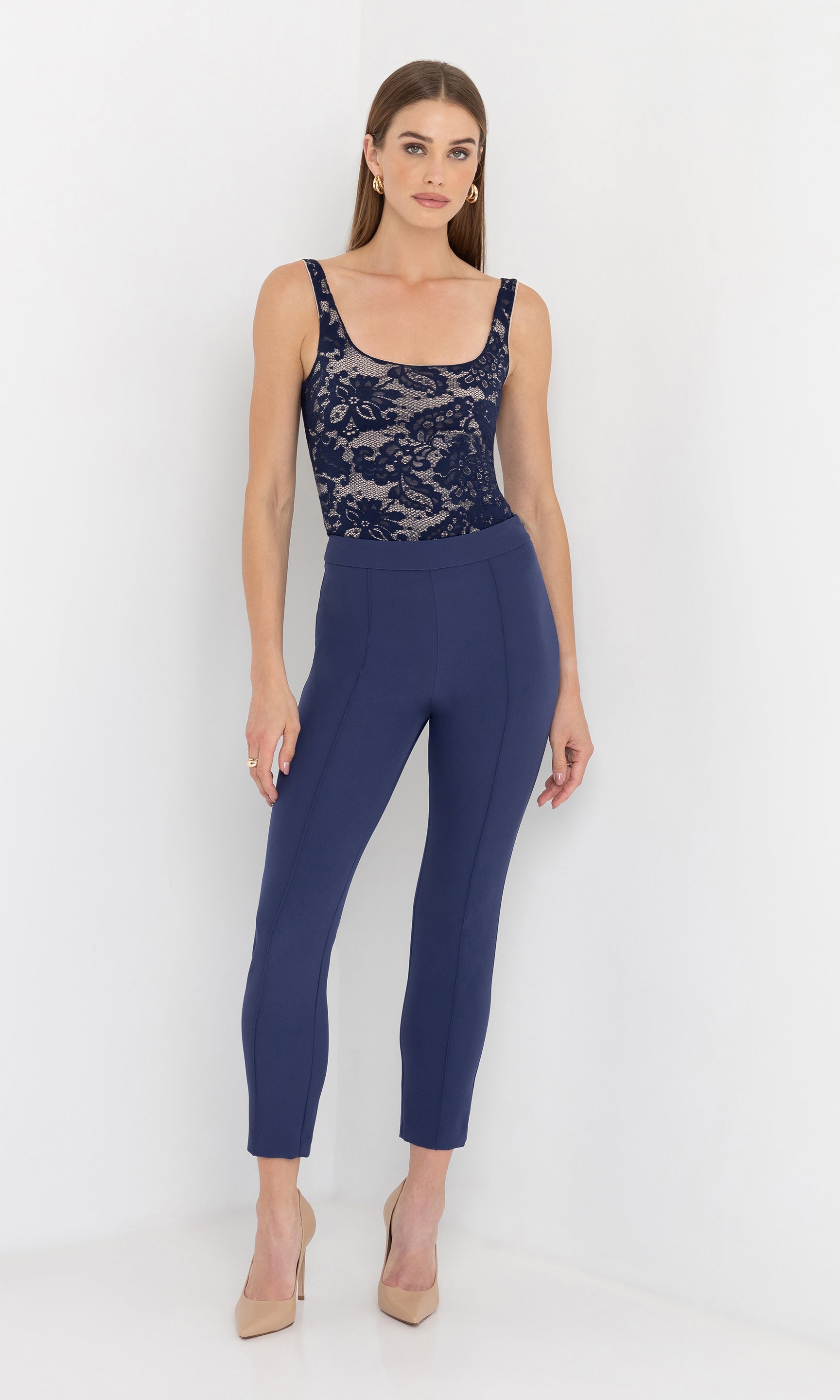 Full body front view of the model wearing the lonny crepe pants styled with a lace top.