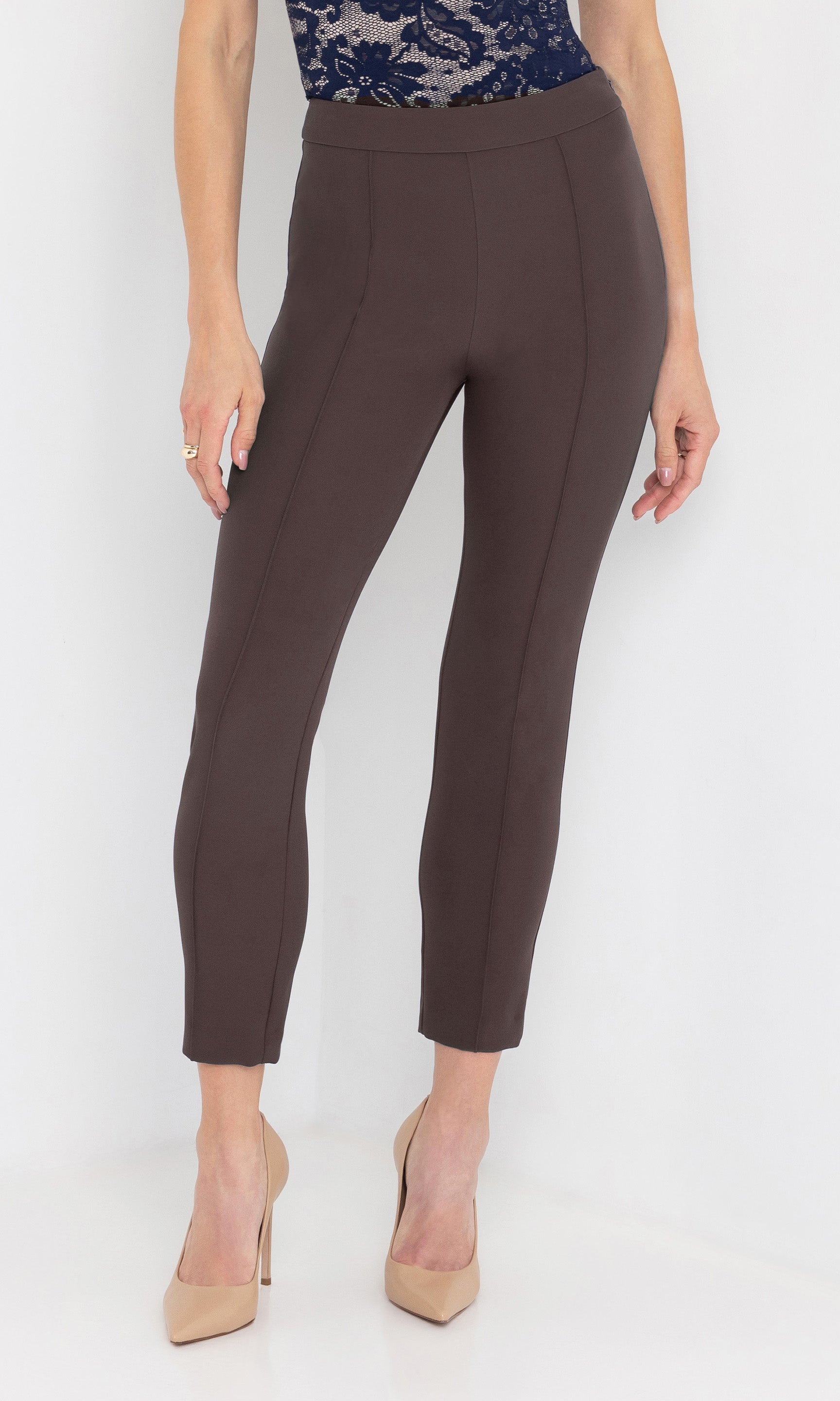 Front view of brown pants worn by a person on a white background