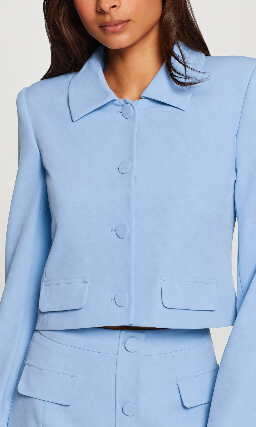Light blue suit with a plain background