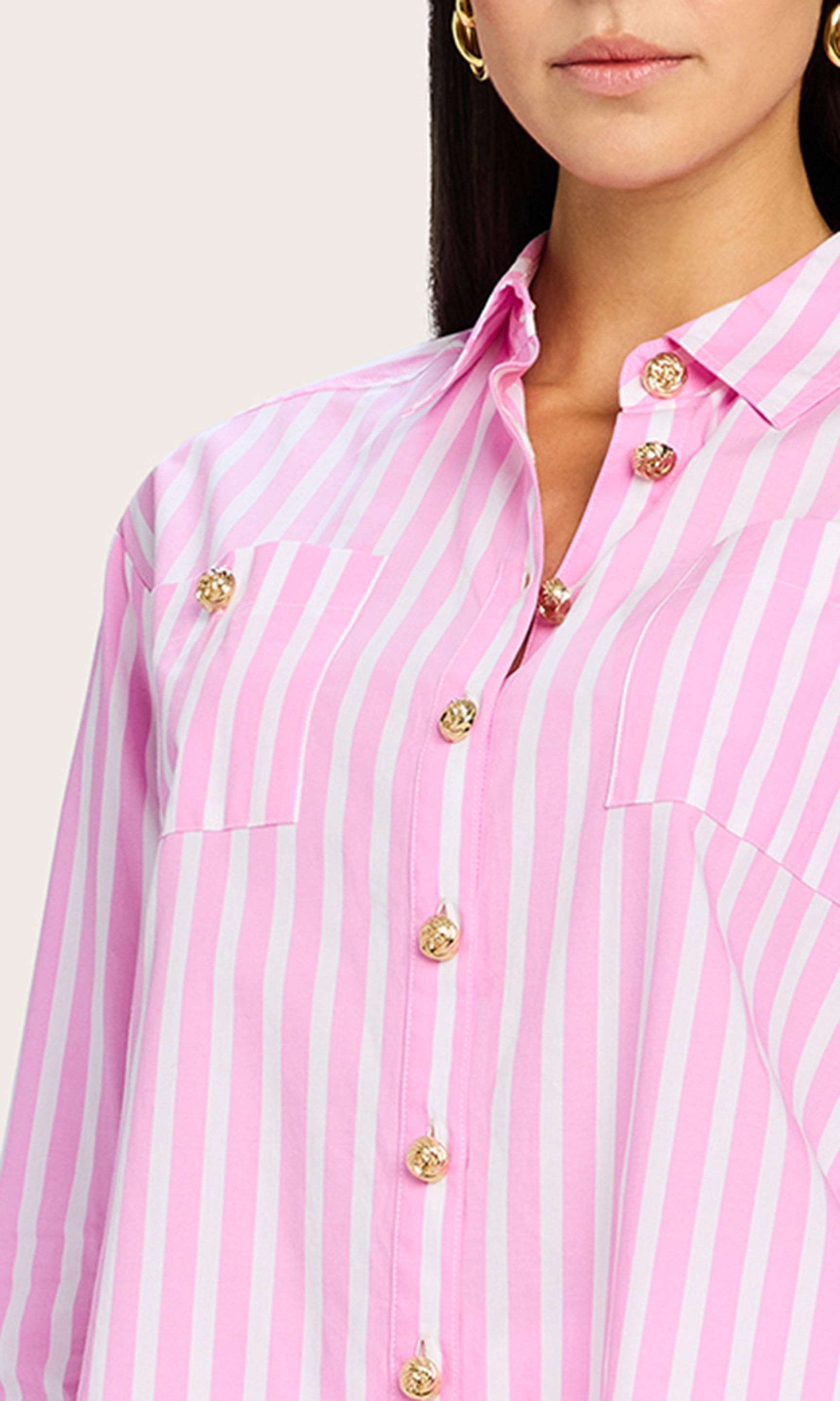 Close-up view of the Meggy Wide Stripe Poplin Shirt highlighting the vertical pink stripes and gold rope buttons